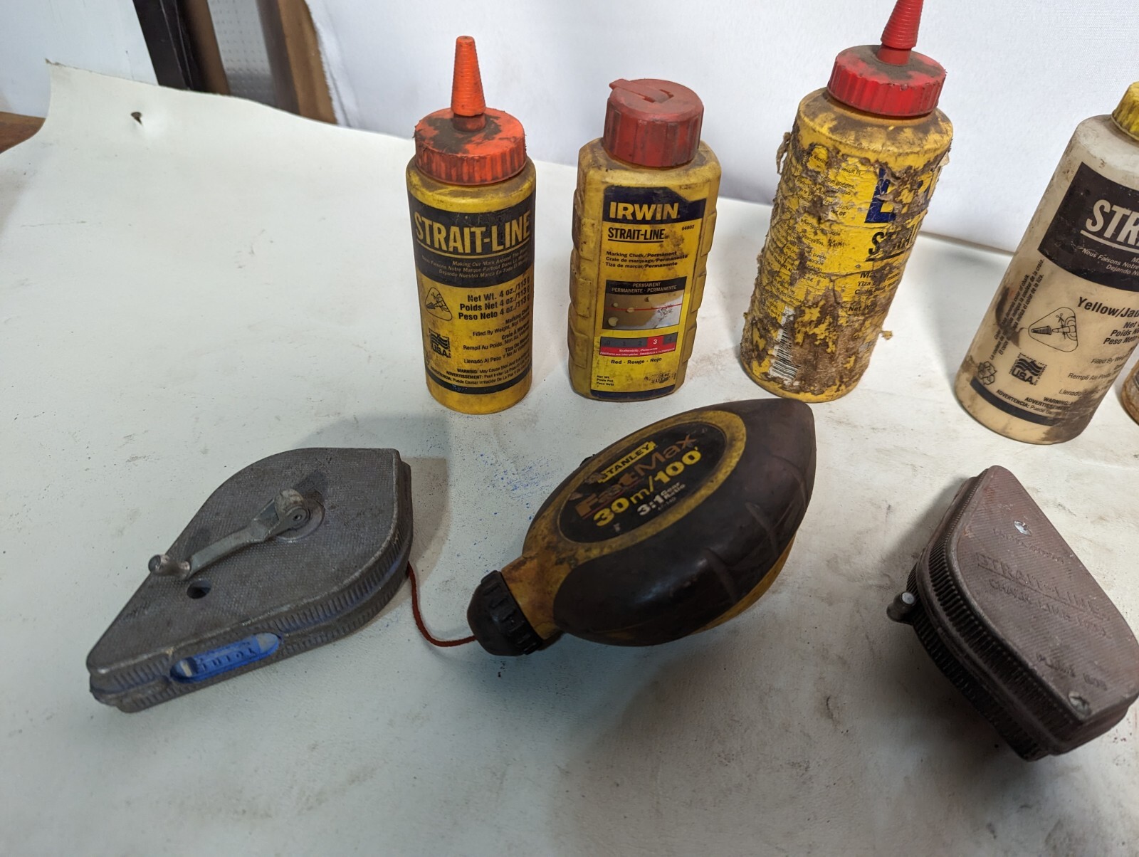 Lot of 9 chalk lines and 3.2 lbs of chalk: Milwaukee 48-22-3910, others
