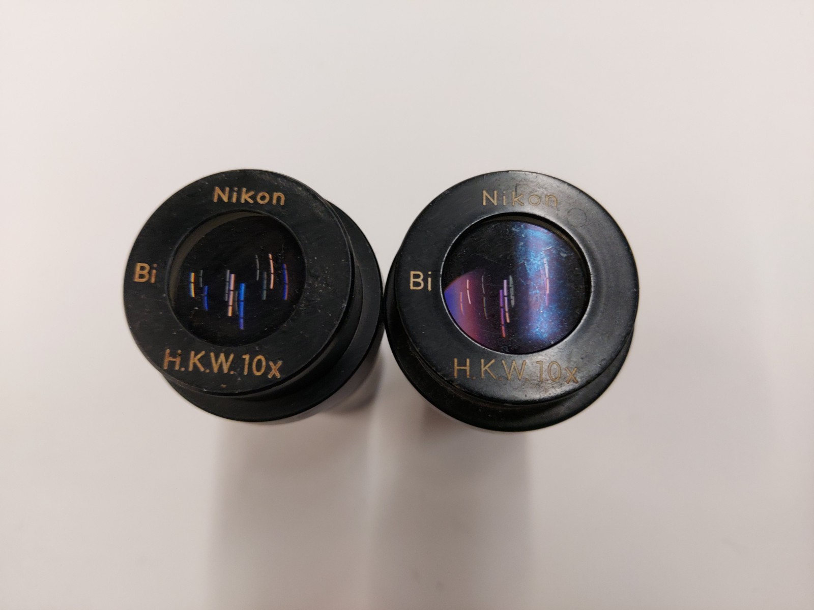 Lot of 2 Nikon H.K.W. 10x Microscope Eyepieces