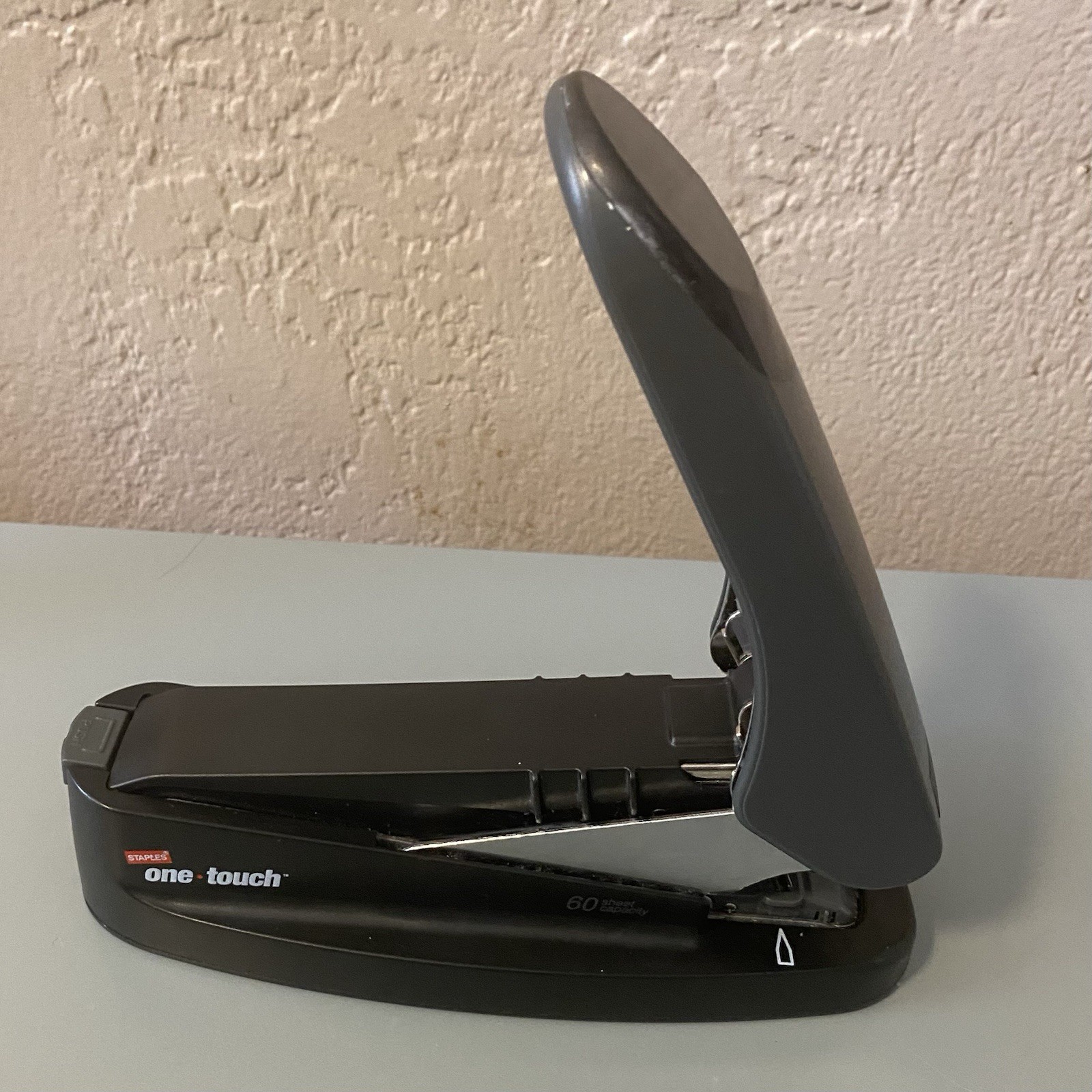 Staples One Touch stapler Up To 60 Pages At A Time. Holds Extra Staples