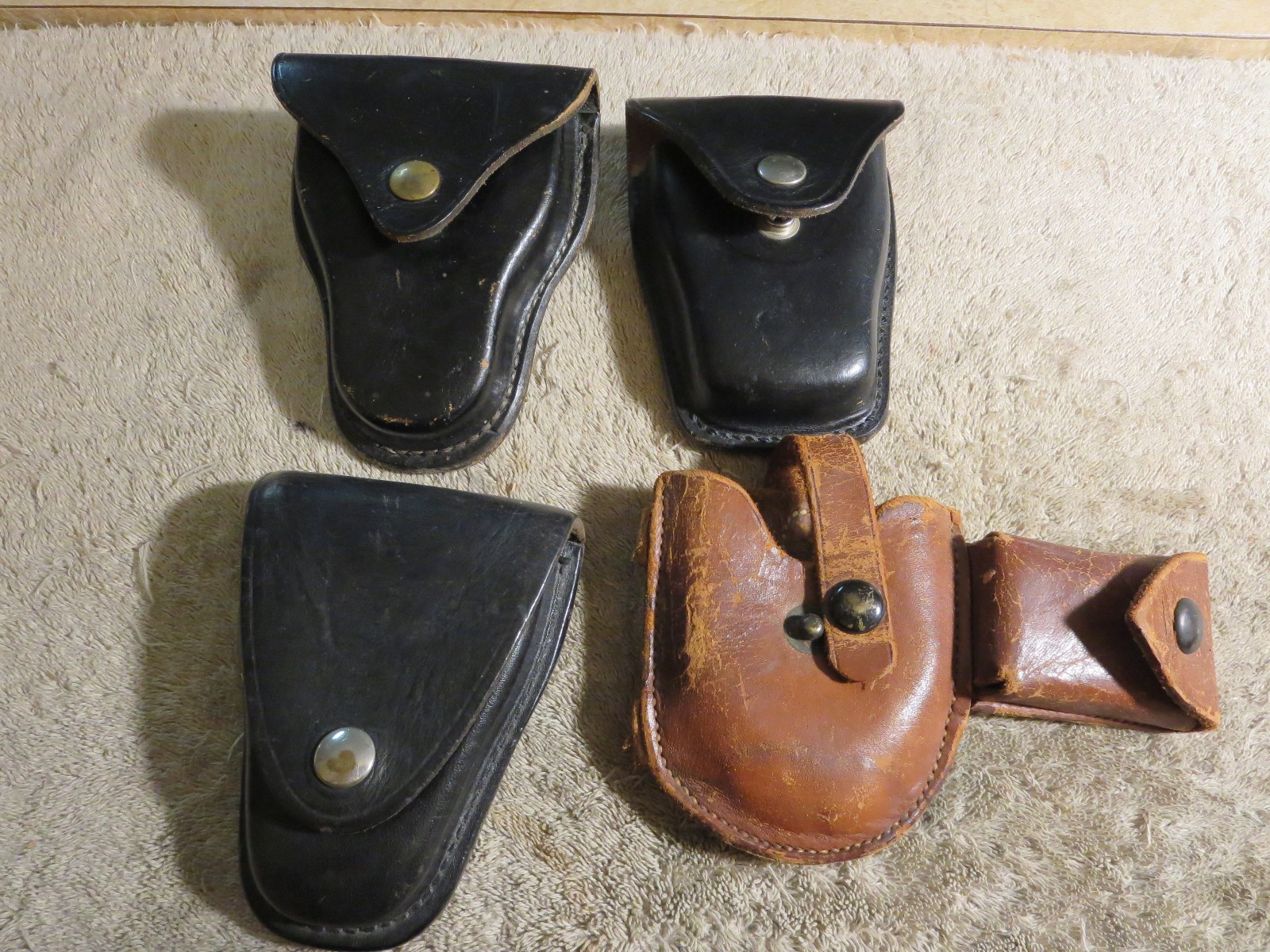 4 handcuff cases: 3 brand names in excellent cond. 1 older, modified, no name.