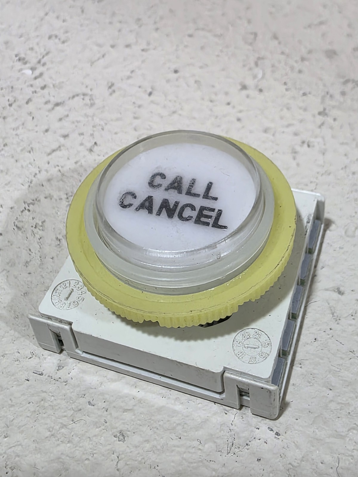 contact block for elevator buttons manufactured by the Italian company DMG
