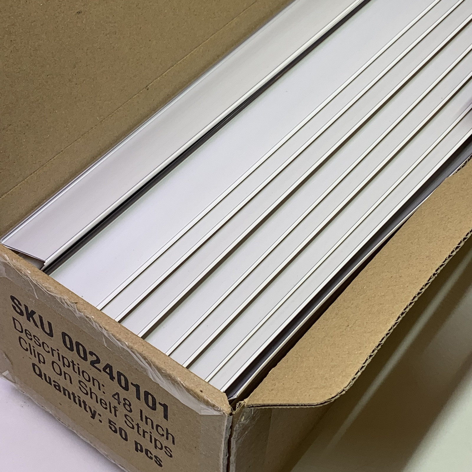 CASE of 50 Beige / Clear 47.5″ Clip-On Price Label Channel for 48″ Gondola Shelf