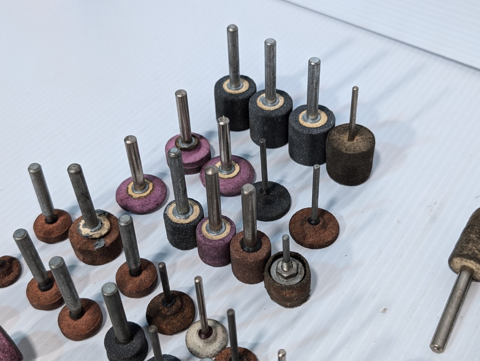 Lot of 144 mounted grinding wheels on shaft as shown, various sizes, shapes, …