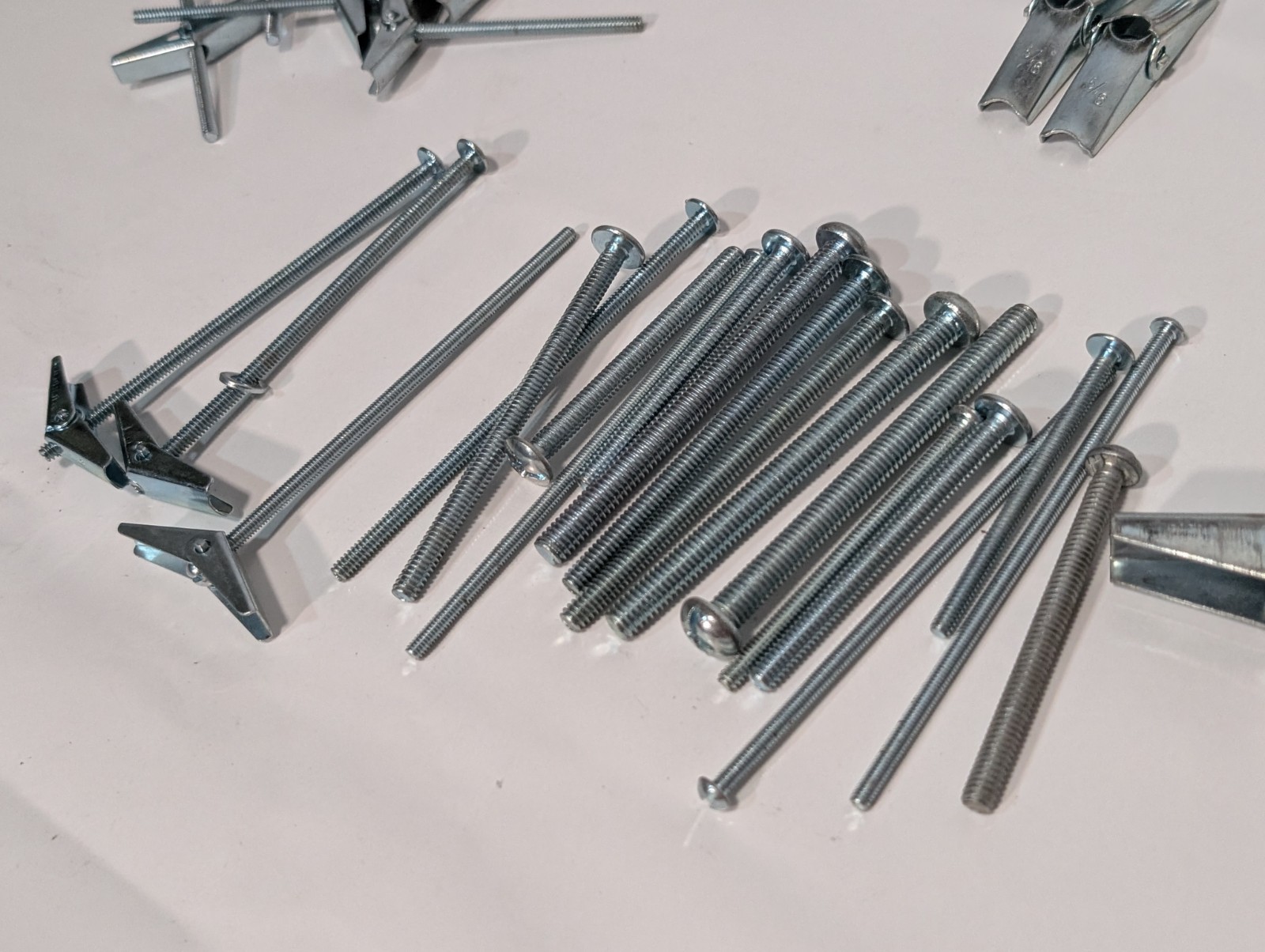 Large Lot of Assorted Sized Hollow Wall Mounting Toggle Bolts Pre-Owned as shown