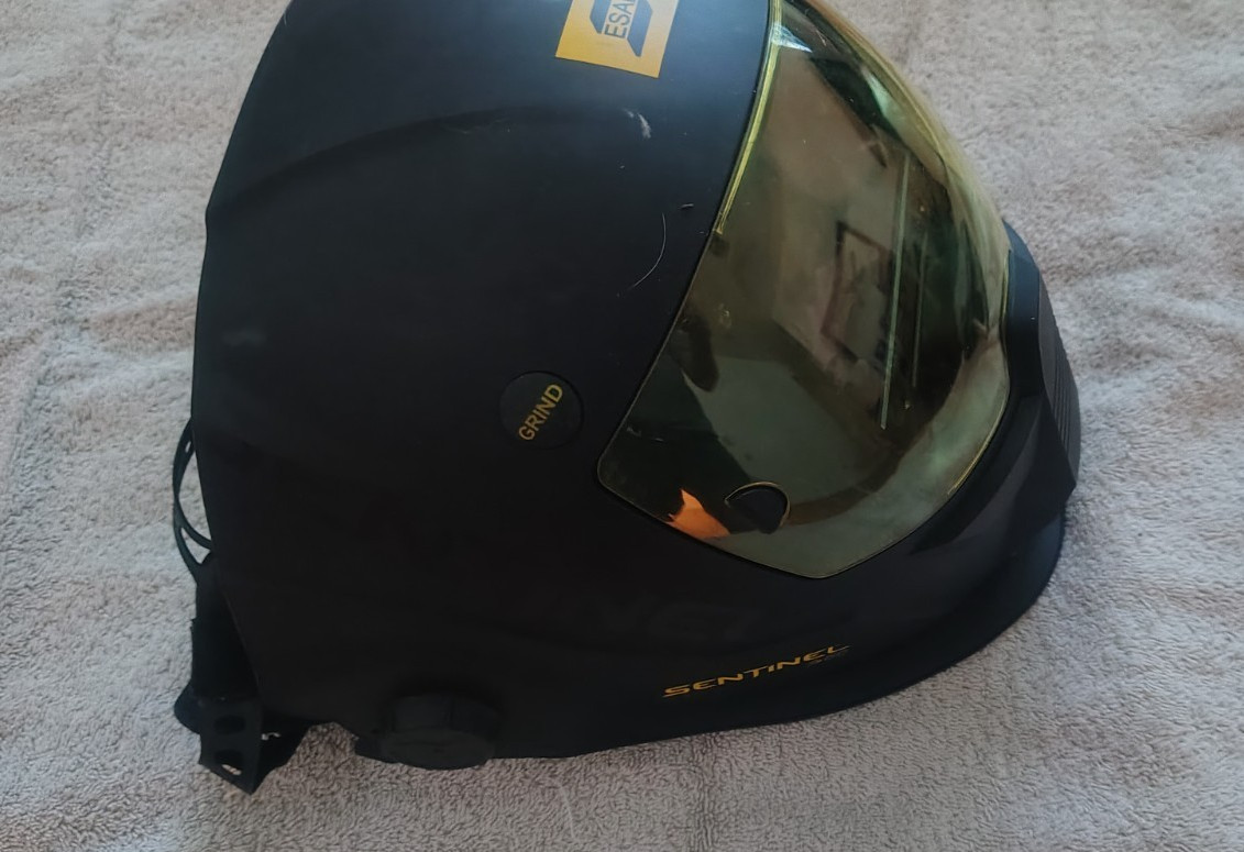 ESAB Sentinel A60 welding helmet, gloves,arm protectors, visiors & carry bag