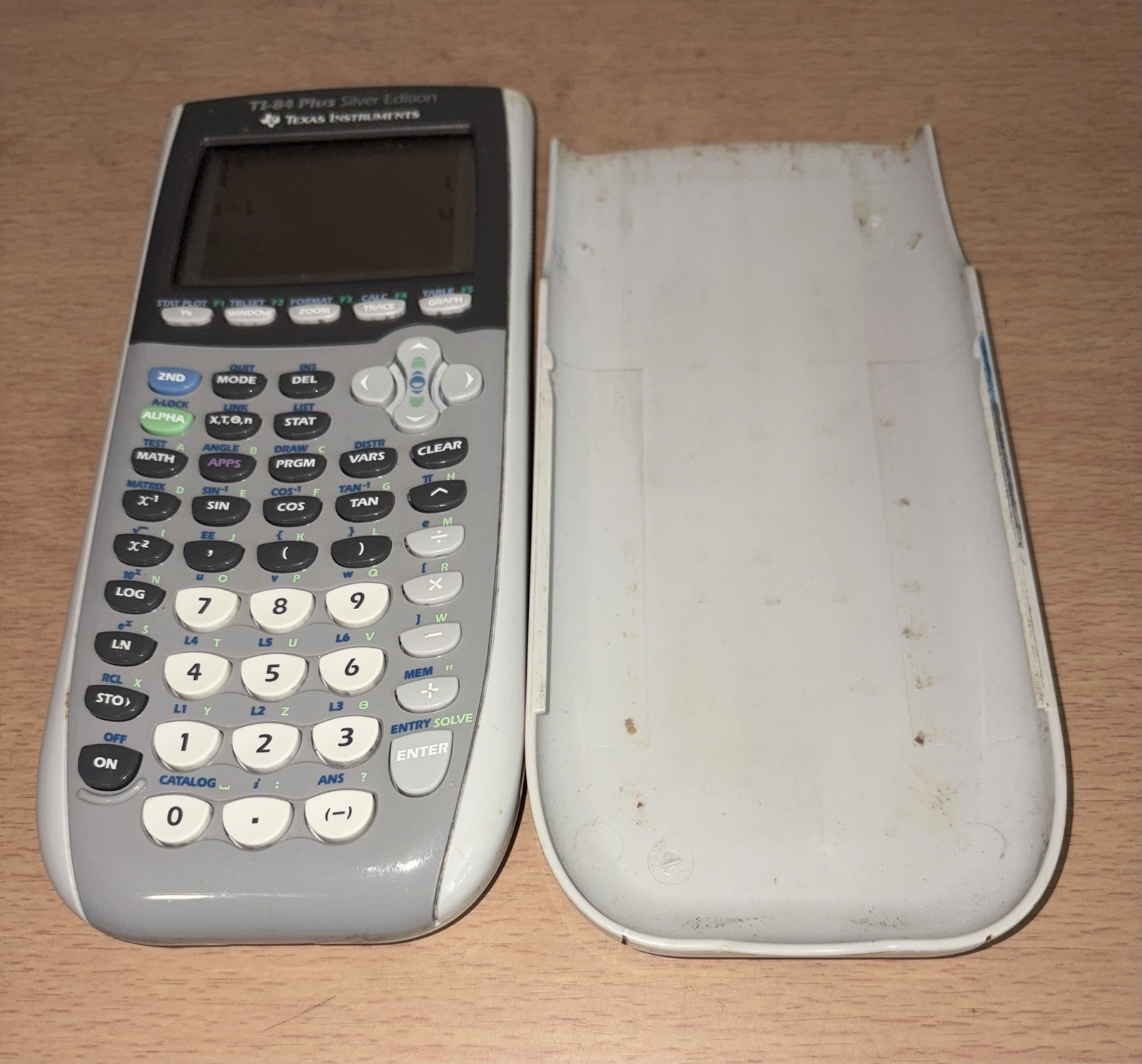 Texas Instruments TI-84 Plus Graphing Calculator – Silver Tested Works