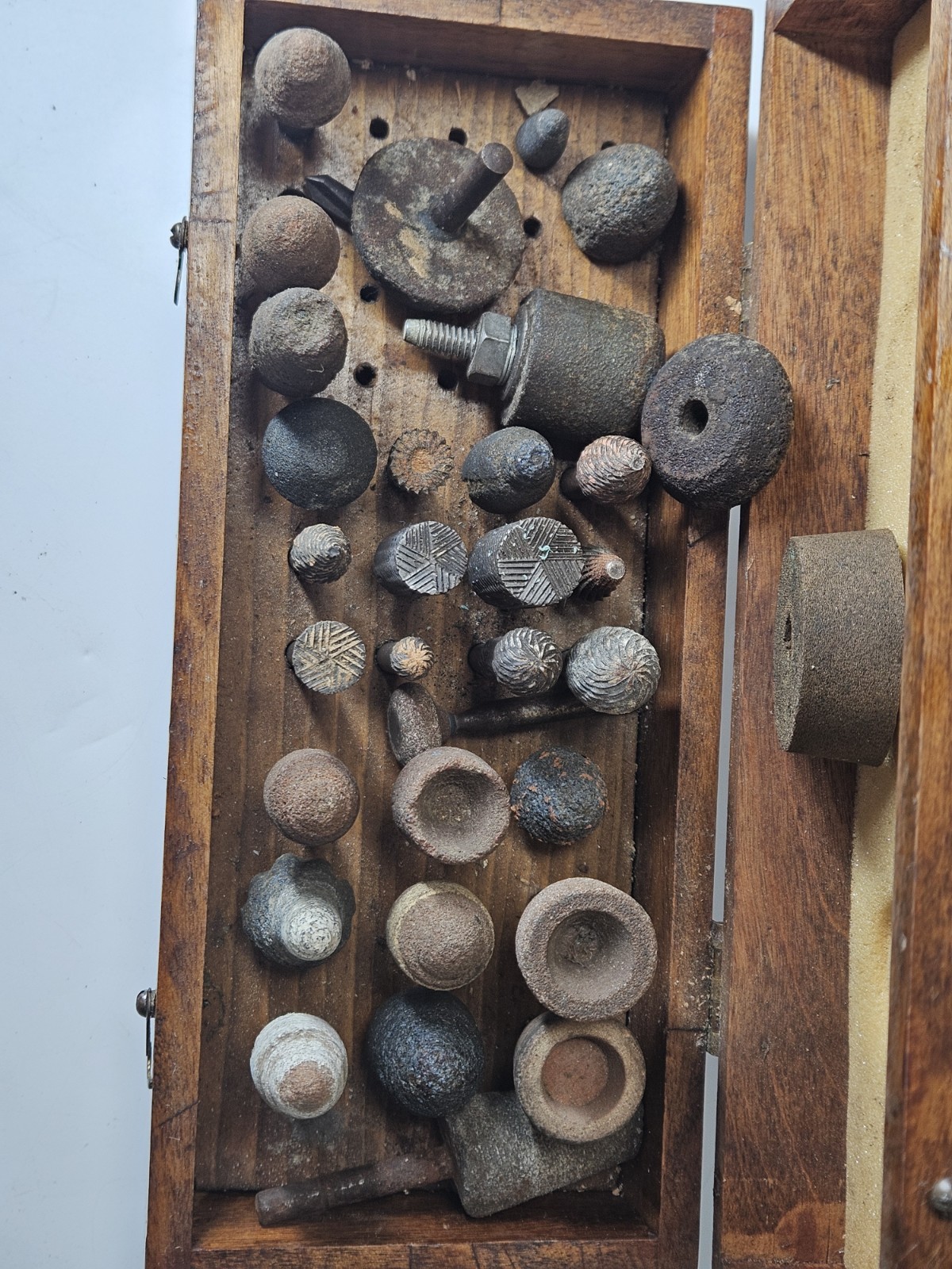 Lot of 30+ mounted grinding wheels on shaft as shown, various sizes With Case