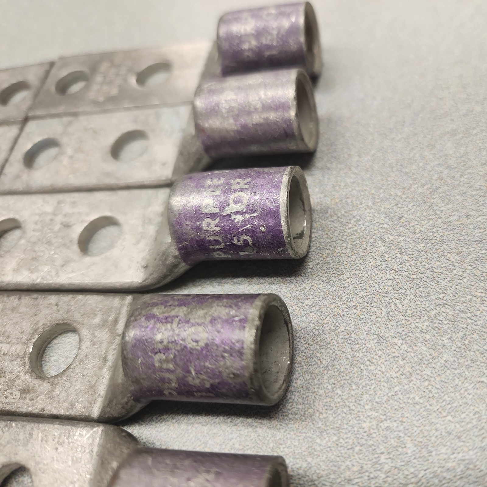 (10) Lug Ends 3/8″ X 1″ spacing 4/0 AWG STR CU Purple Die 15 54