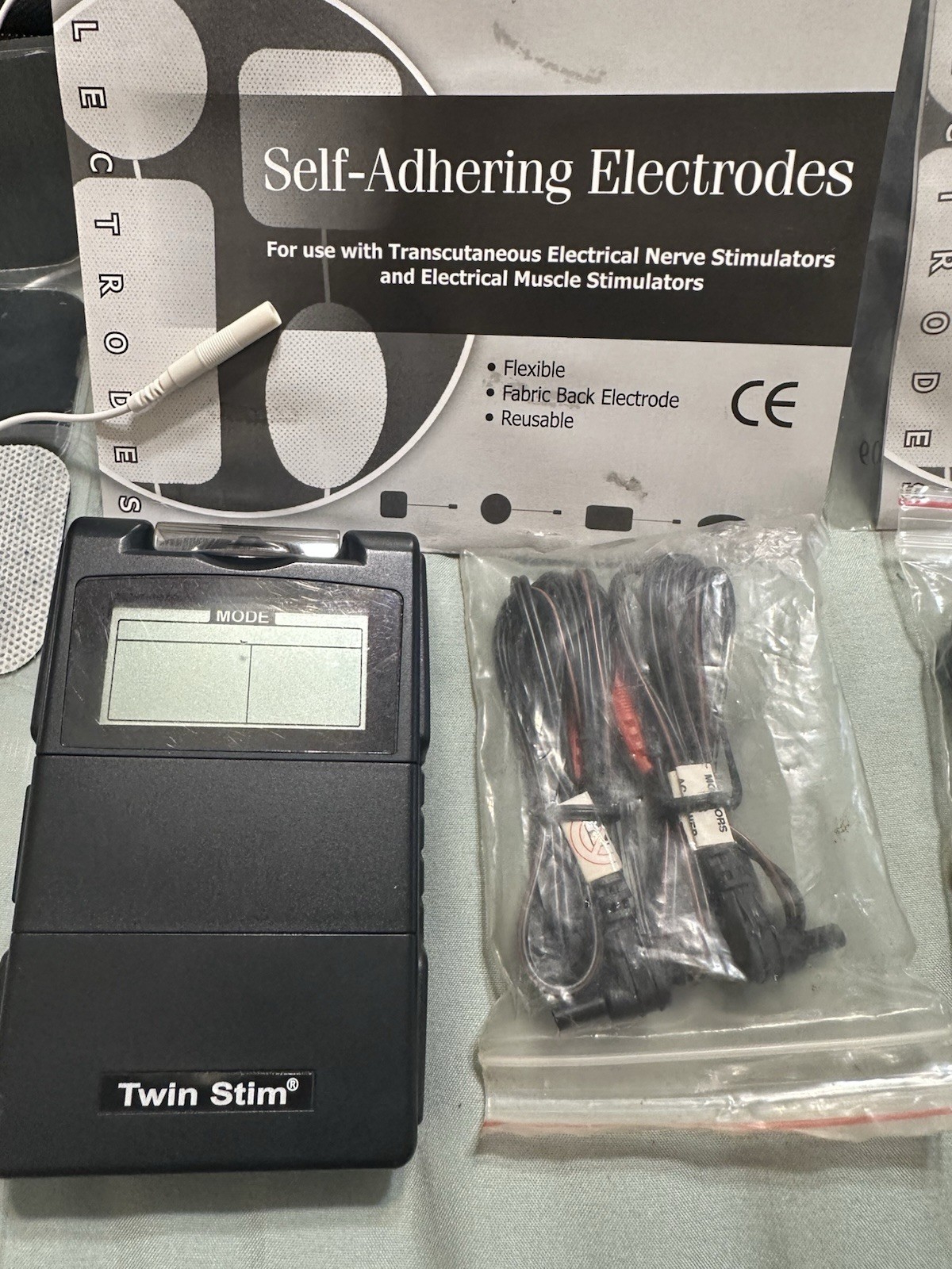 Twin Stim TENS/EMS Unit Handheld with Electrodes and Accessories
