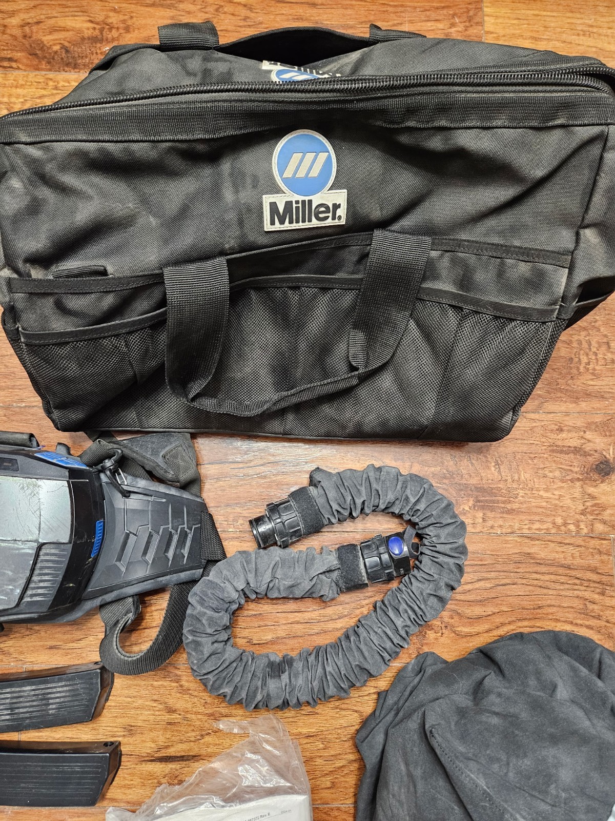 Miller T94iH-R Auto-Darkening Welding Helmet PAPR Kit W/Batteries, Hose, and Bag