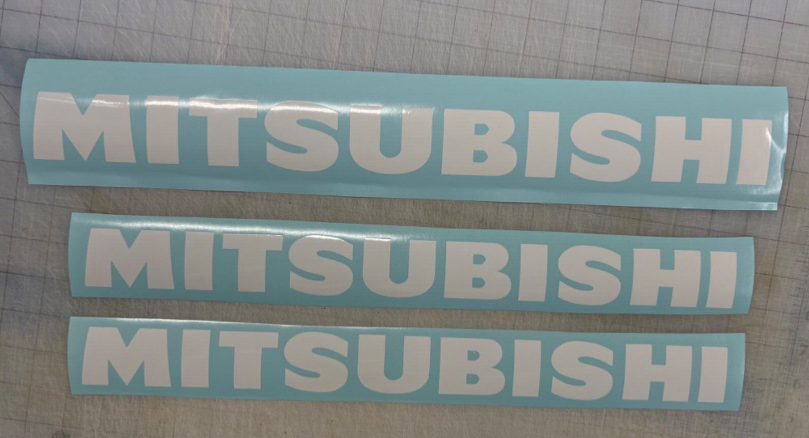 2- 18 inch Mitsubishi Forklift decals and 1- 20 inch decal