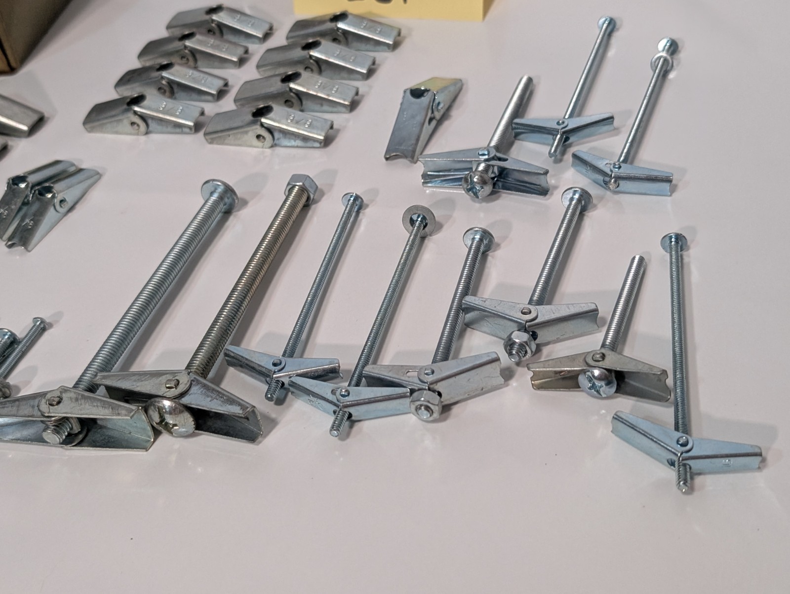Large Lot of Assorted Sized Hollow Wall Mounting Toggle Bolts Pre-Owned as shown