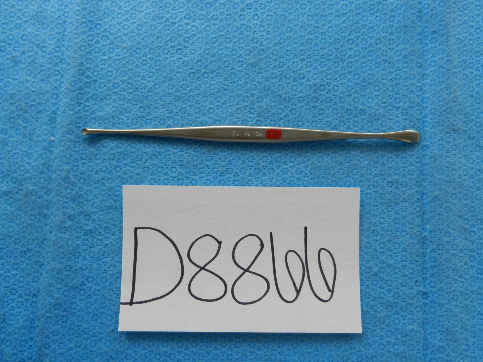 D8866 V. Mueller Penfield Double Ended Fully Curved with Wax Packer NL1091