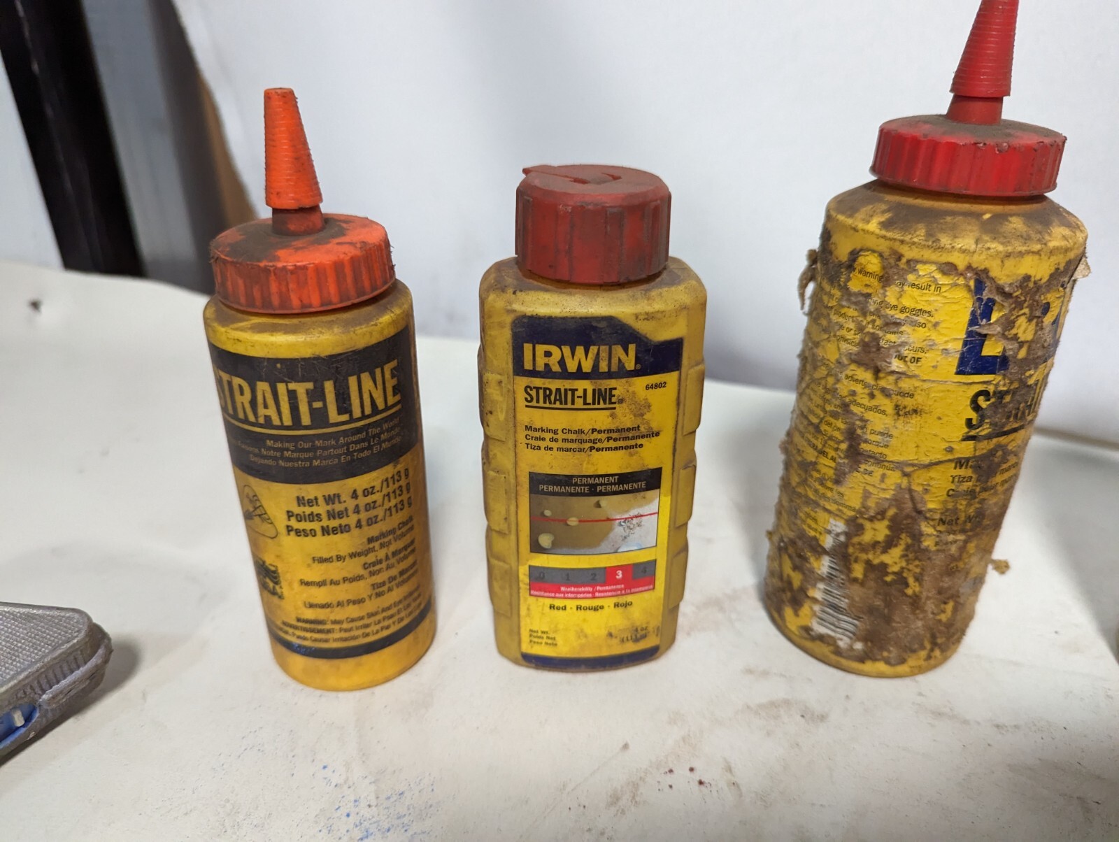 Lot of 9 chalk lines and 3.2 lbs of chalk: Milwaukee 48-22-3910, others