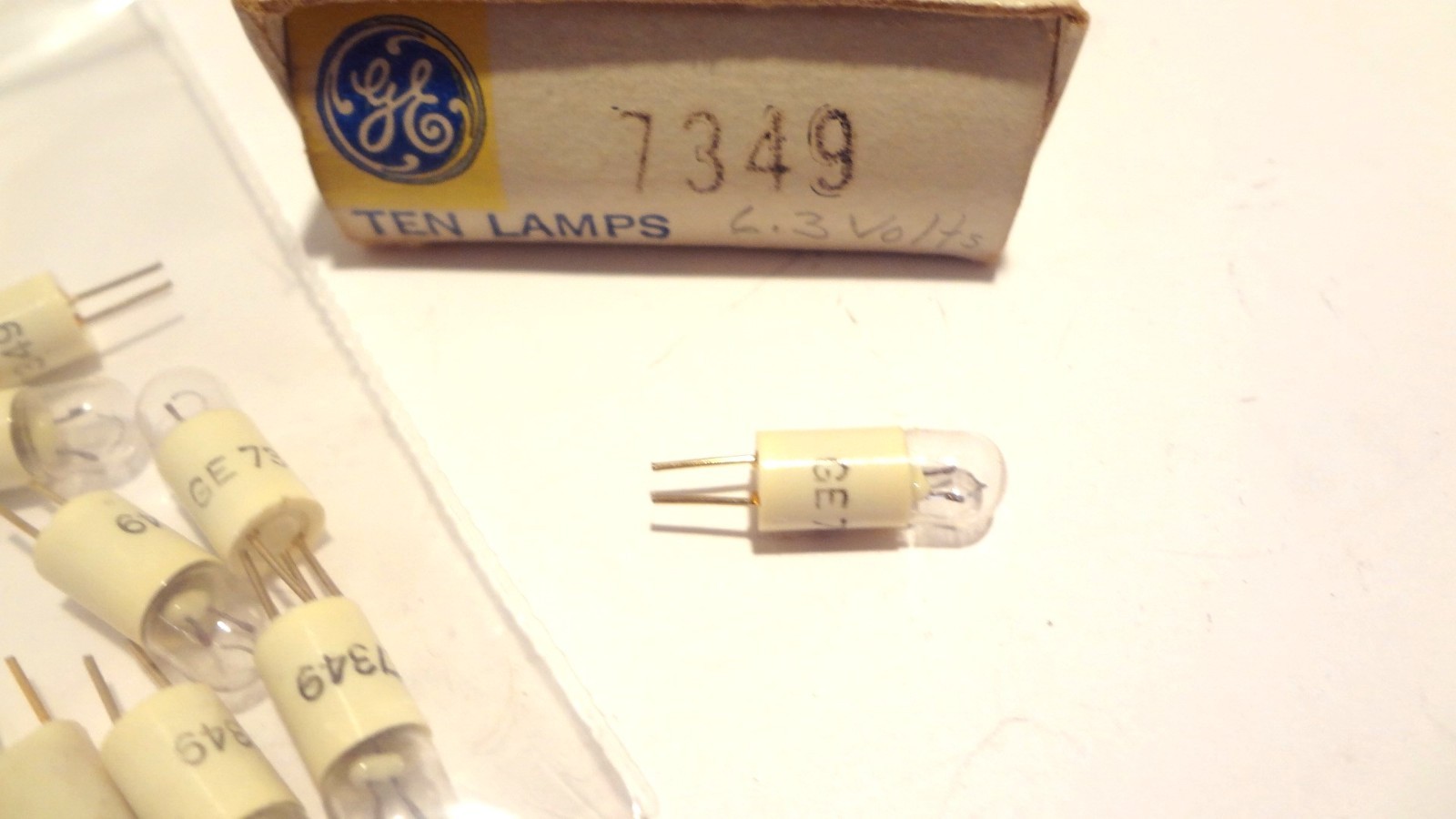 GE LAMPS # 7349 BOX OF (9EA) 6.3VOLT, 1. WATT MINATURE PIN BASE**NEW**