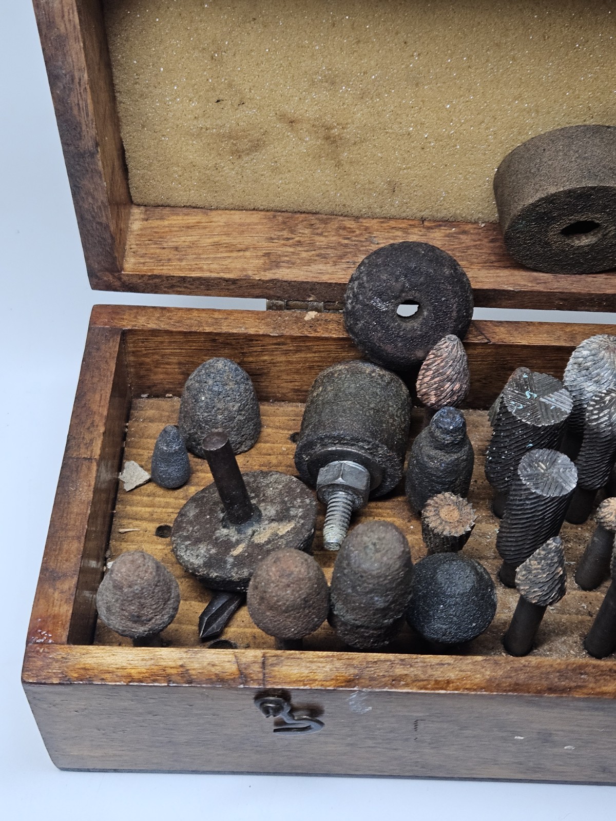 Lot of 30+ mounted grinding wheels on shaft as shown, various sizes With Case