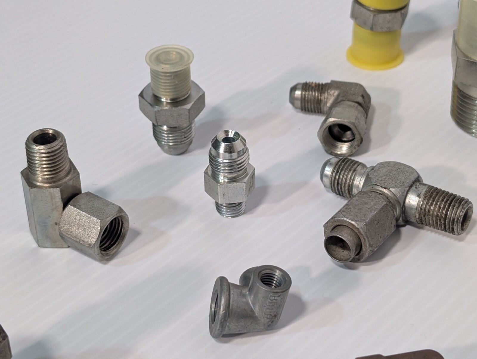 Mixed Lot of Female & Male Swivel Nut Elbow & Industrial Plug Fittings, as shown