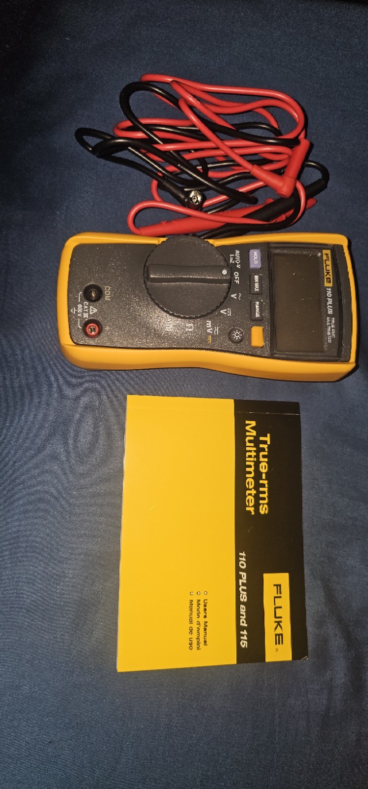 The Fluke 110 Plus True-RMS Digital Multimeter with Test Leads and Manual