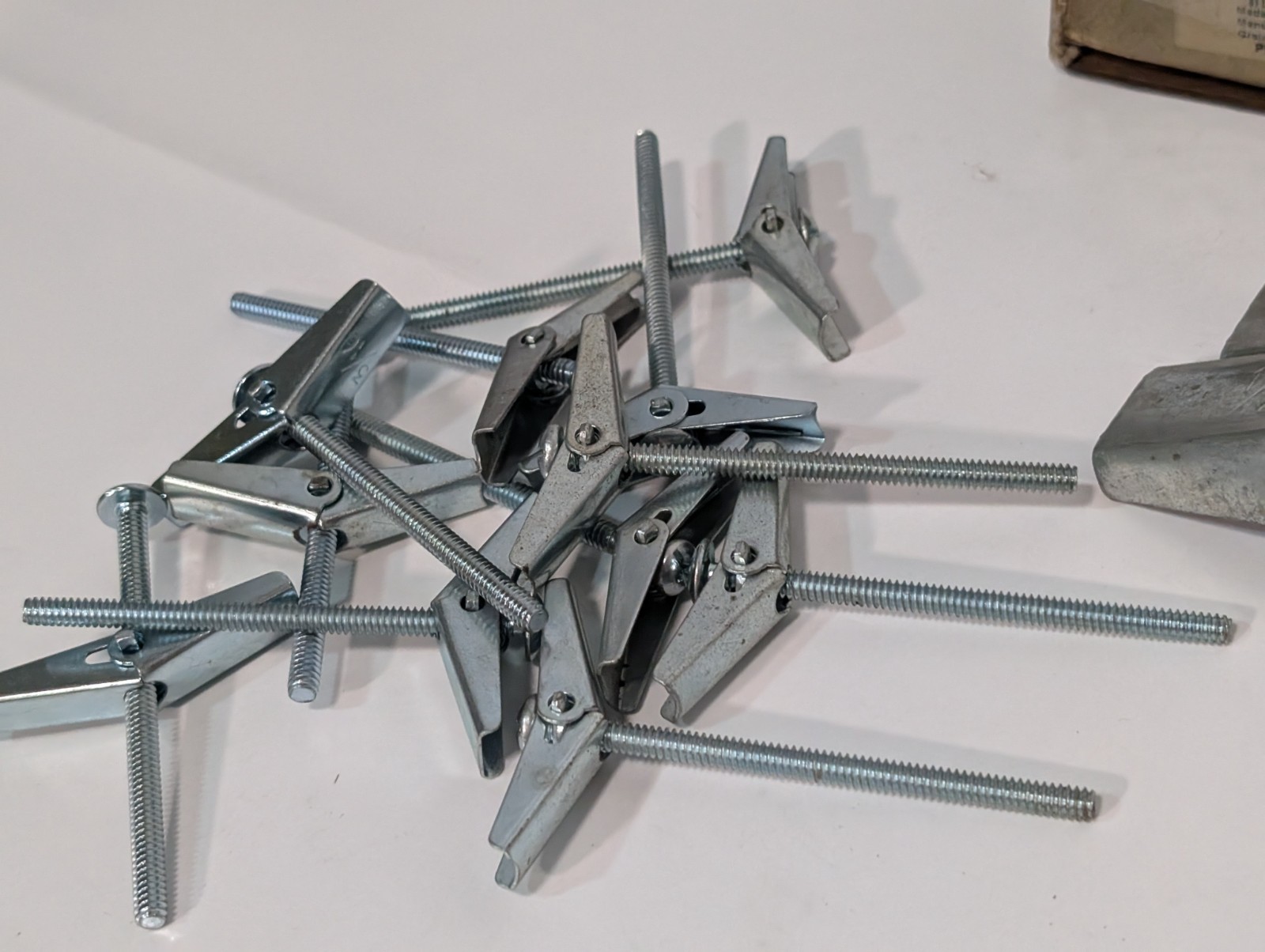 Large Lot of Assorted Sized Hollow Wall Mounting Toggle Bolts Pre-Owned as shown