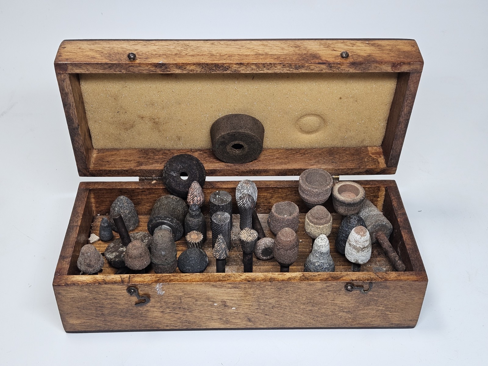 Lot of 30+ mounted grinding wheels on shaft as shown, various sizes With Case