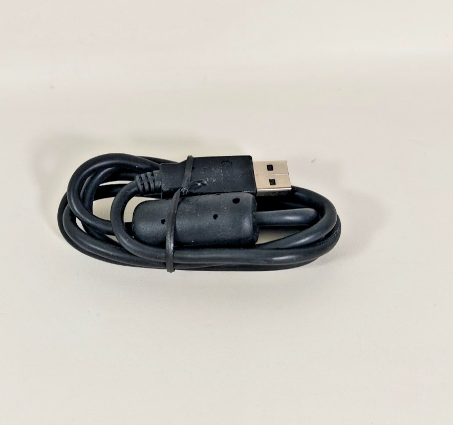 Texas Instruments Ti 84 Plus Ce Graphing Calculator with a charger cable