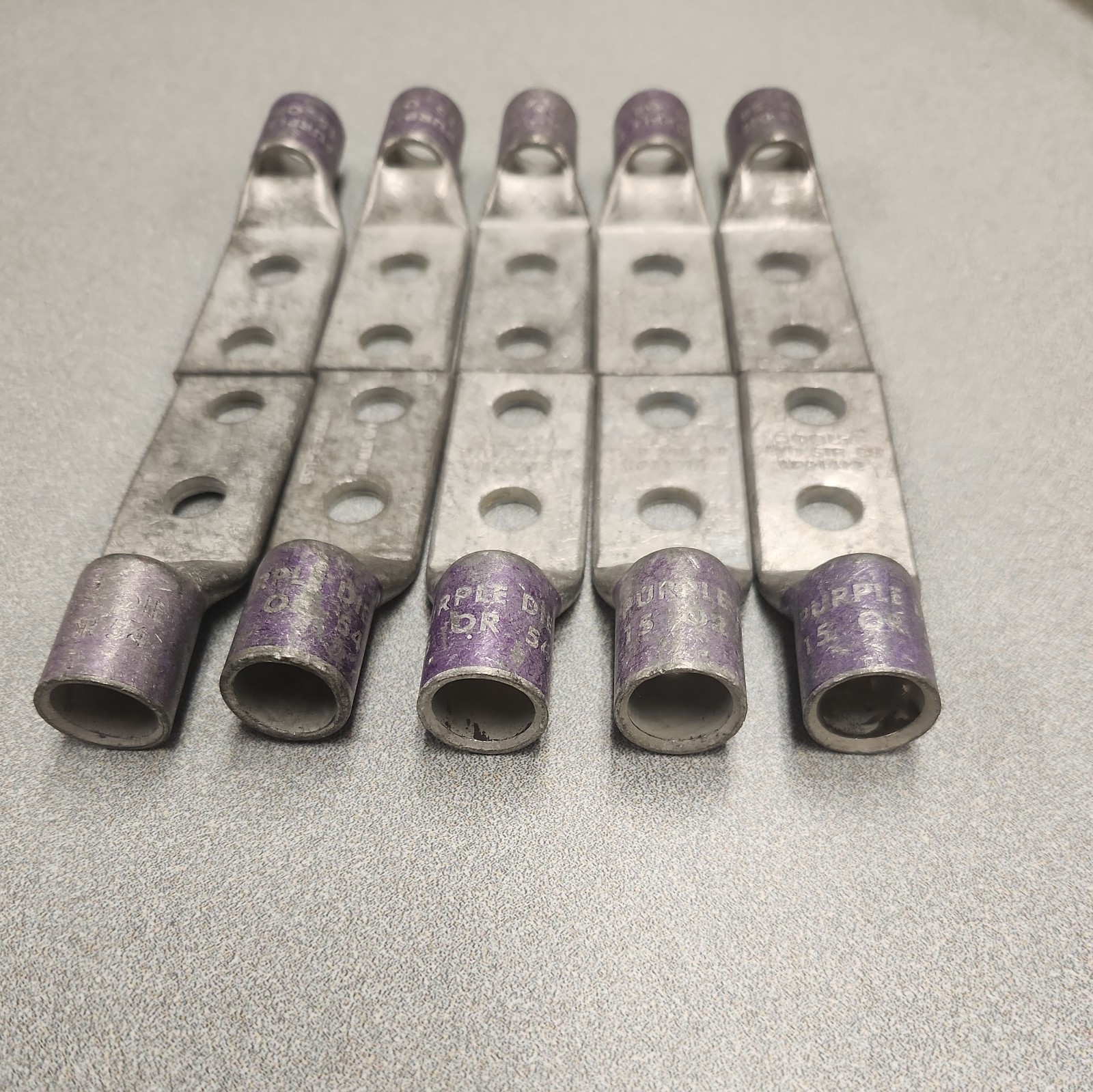 (10) Lug Ends 3/8″ X 1″ spacing 4/0 AWG STR CU Purple Die 15 54