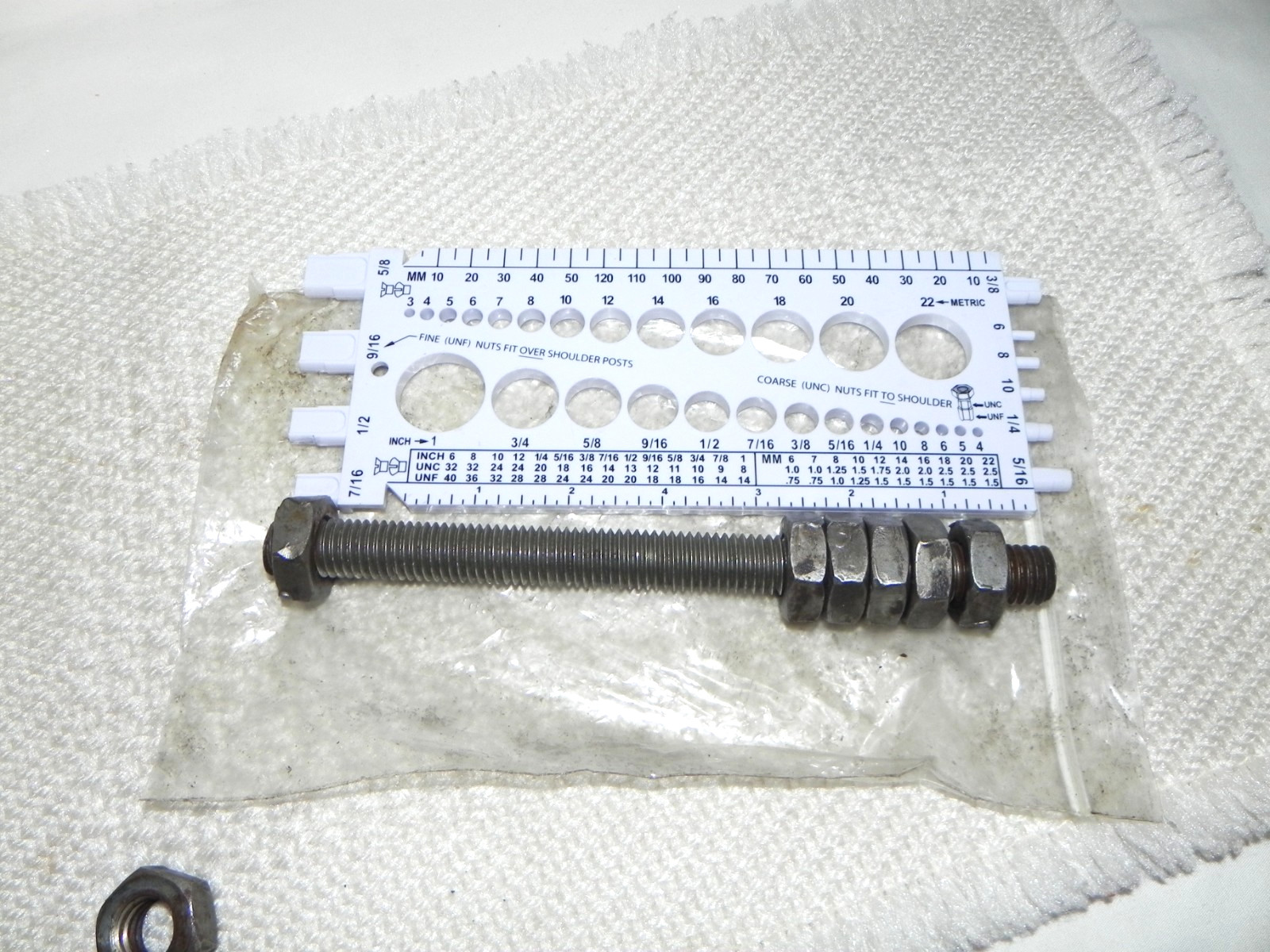 1) 5/8-11 x 8″ Stud with 7 nuts, this could be bolt with head cut off