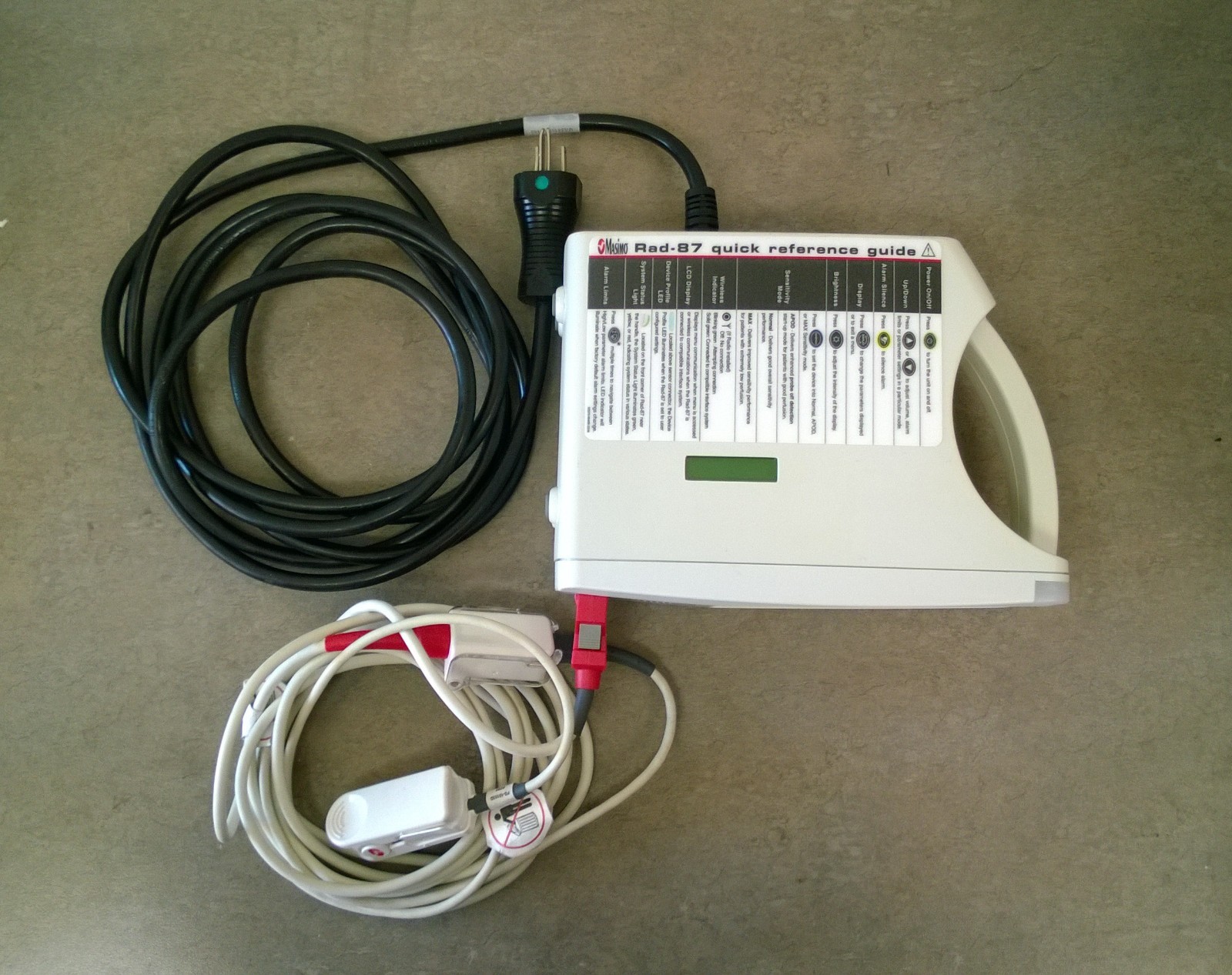 Masimo Rad 87V Pulse Oximeter, with OEM patient cable, adult sensor, and AC cord