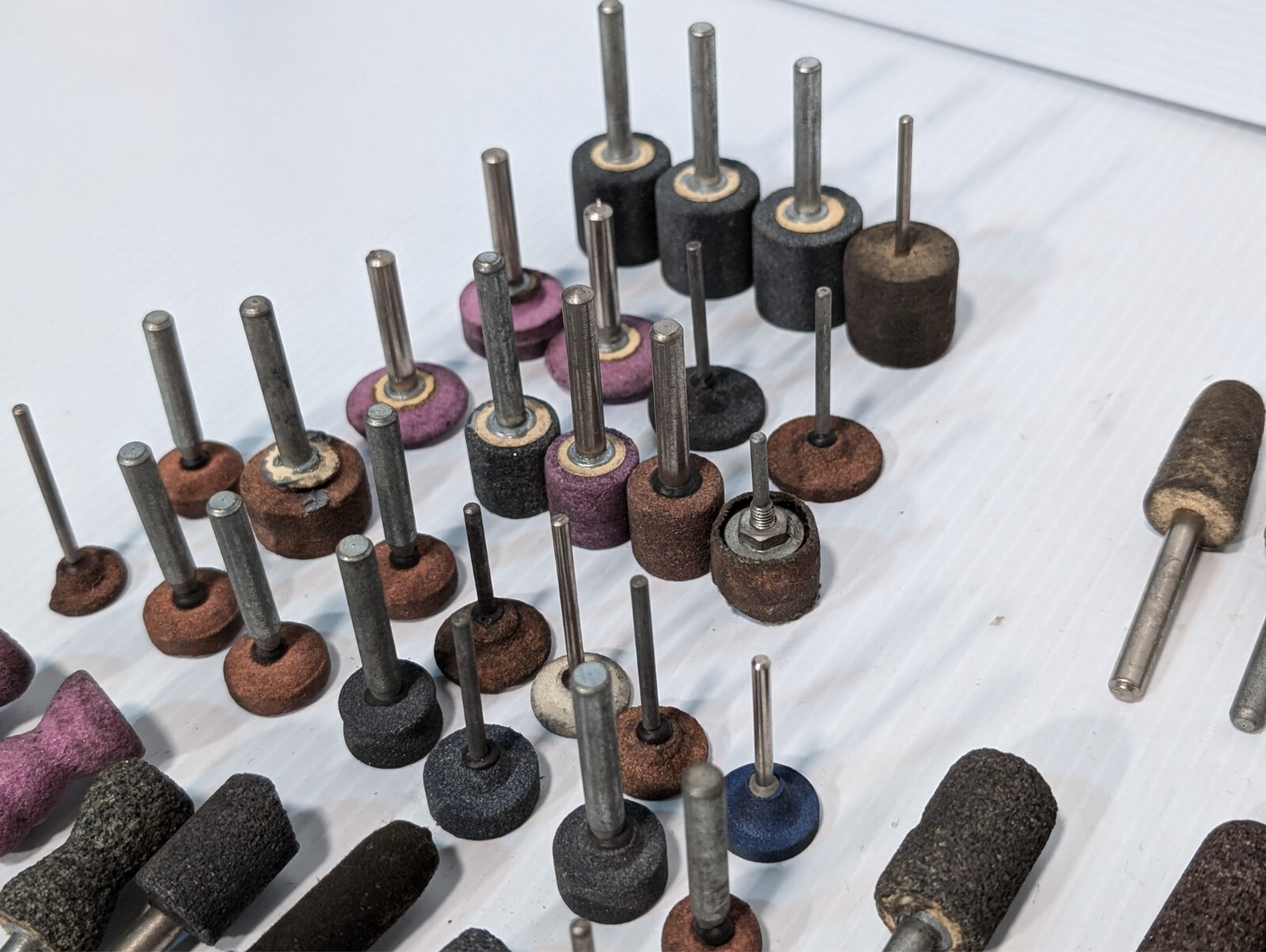 Lot of 144 mounted grinding wheels on shaft as shown, various sizes, shapes, …