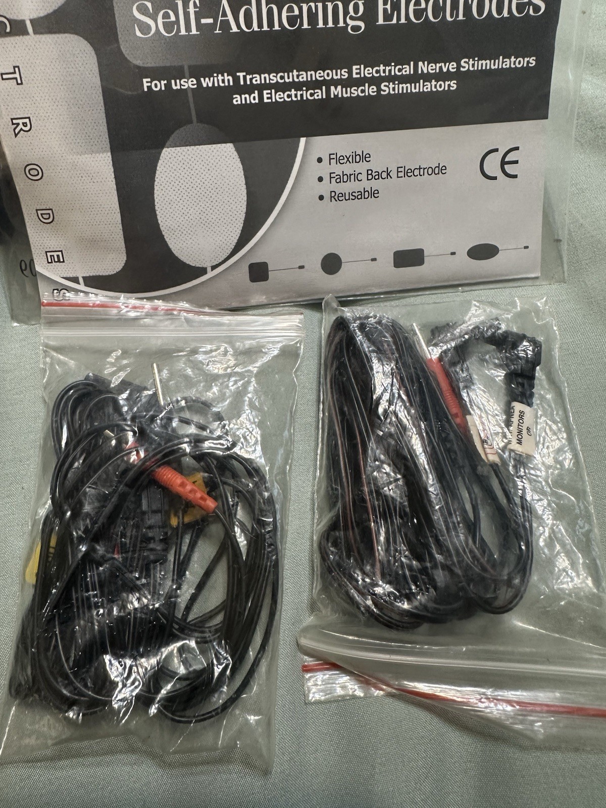 Twin Stim TENS/EMS Unit Handheld with Electrodes and Accessories