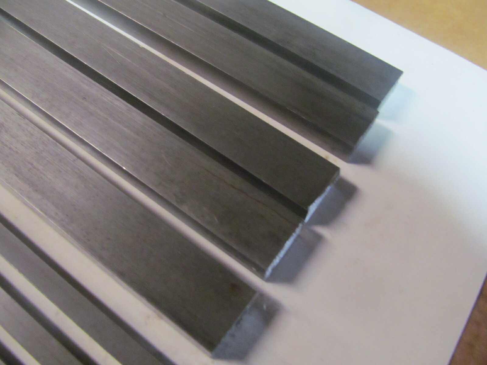 (10) PIECES OF RECTANGLE STEEL,12L14 BAR STOCK 12″ LONG (2) DIFFERENT SIZES.