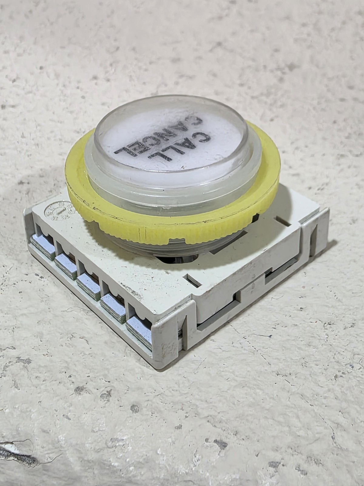 contact block for elevator buttons manufactured by the Italian company DMG