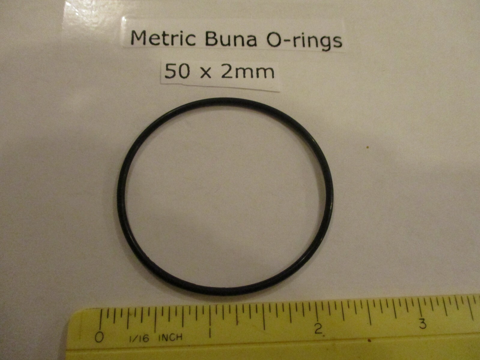 50mm ID x 54mm OD x 2mm thick O-ring. Buna-70. Quan 1.