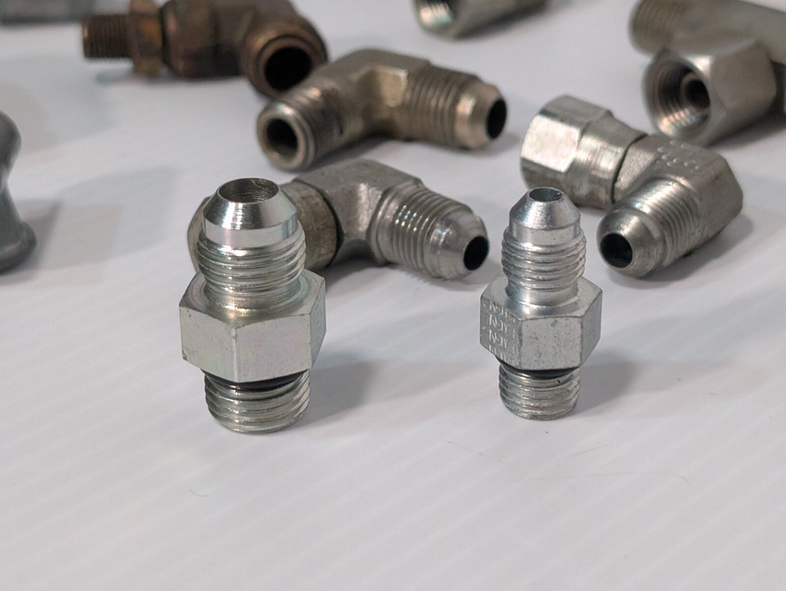 Mixed Lot of Female & Male Swivel Nut Elbow & Industrial Plug Fittings, as shown