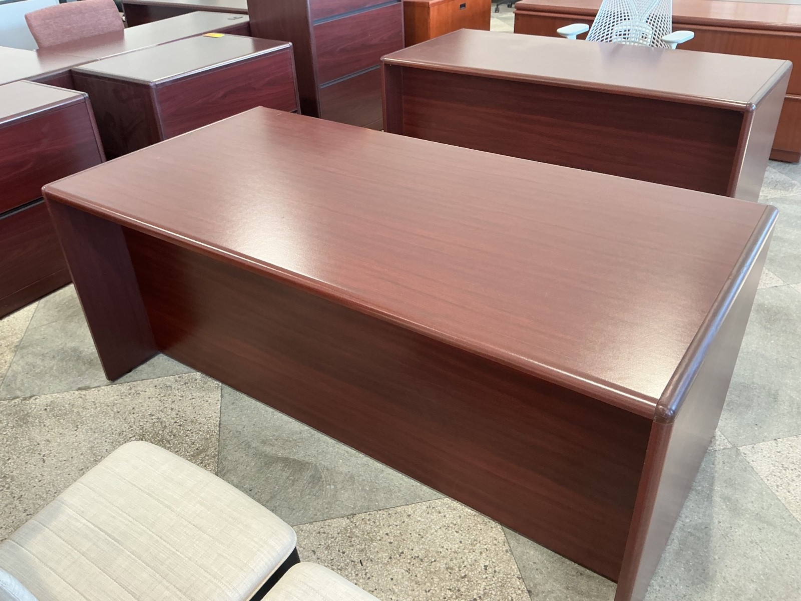 6’W x 3’D executive double pedestal desk by OFS in Mahogany Laminate