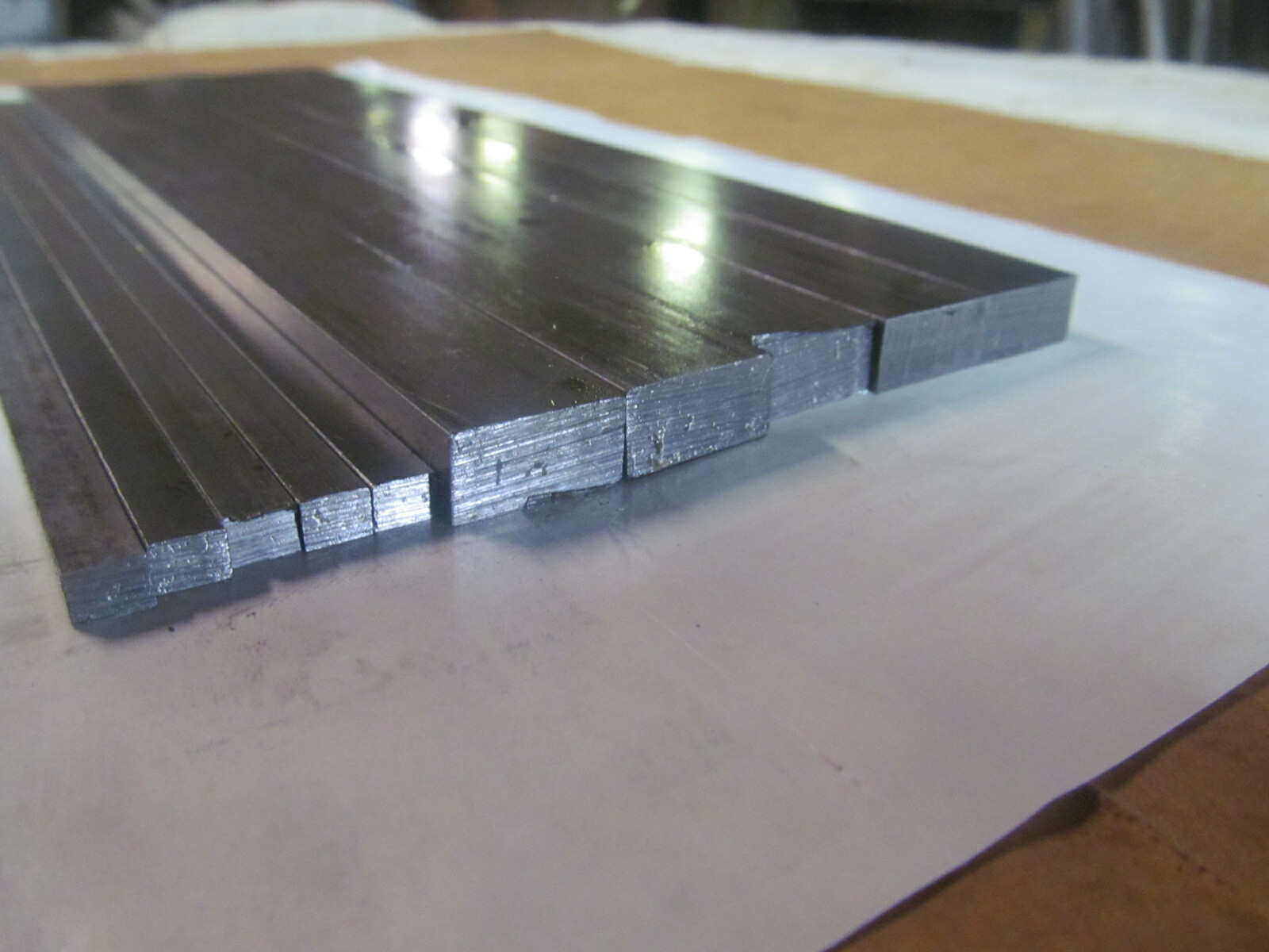 (10) PIECES OF RECTANGLE STEEL,12L14 BAR STOCK 12″ LONG (2) DIFFERENT SIZES.