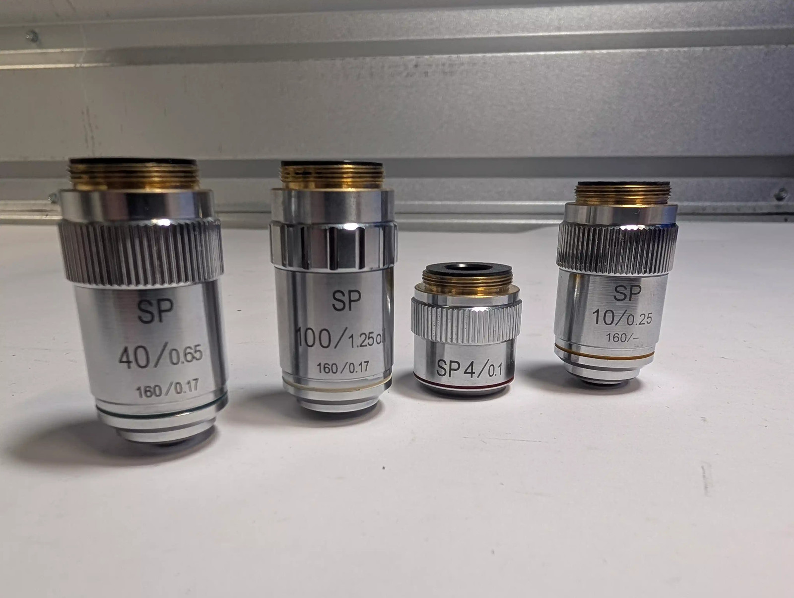 Set of 4 SP Microscope Objective Lenses: 4x, 10x, 40x, 100x Oil