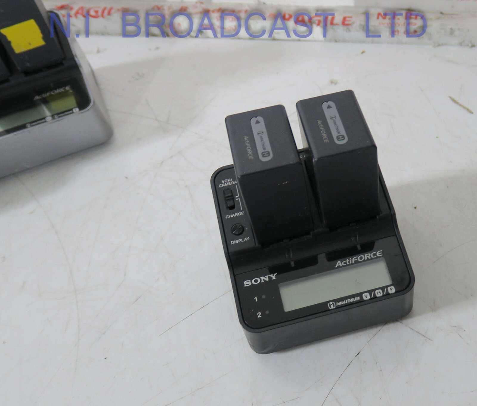 1x Sony actiforce charger with 2x lithium ion np-fh100 batteries  (26wh ) batte