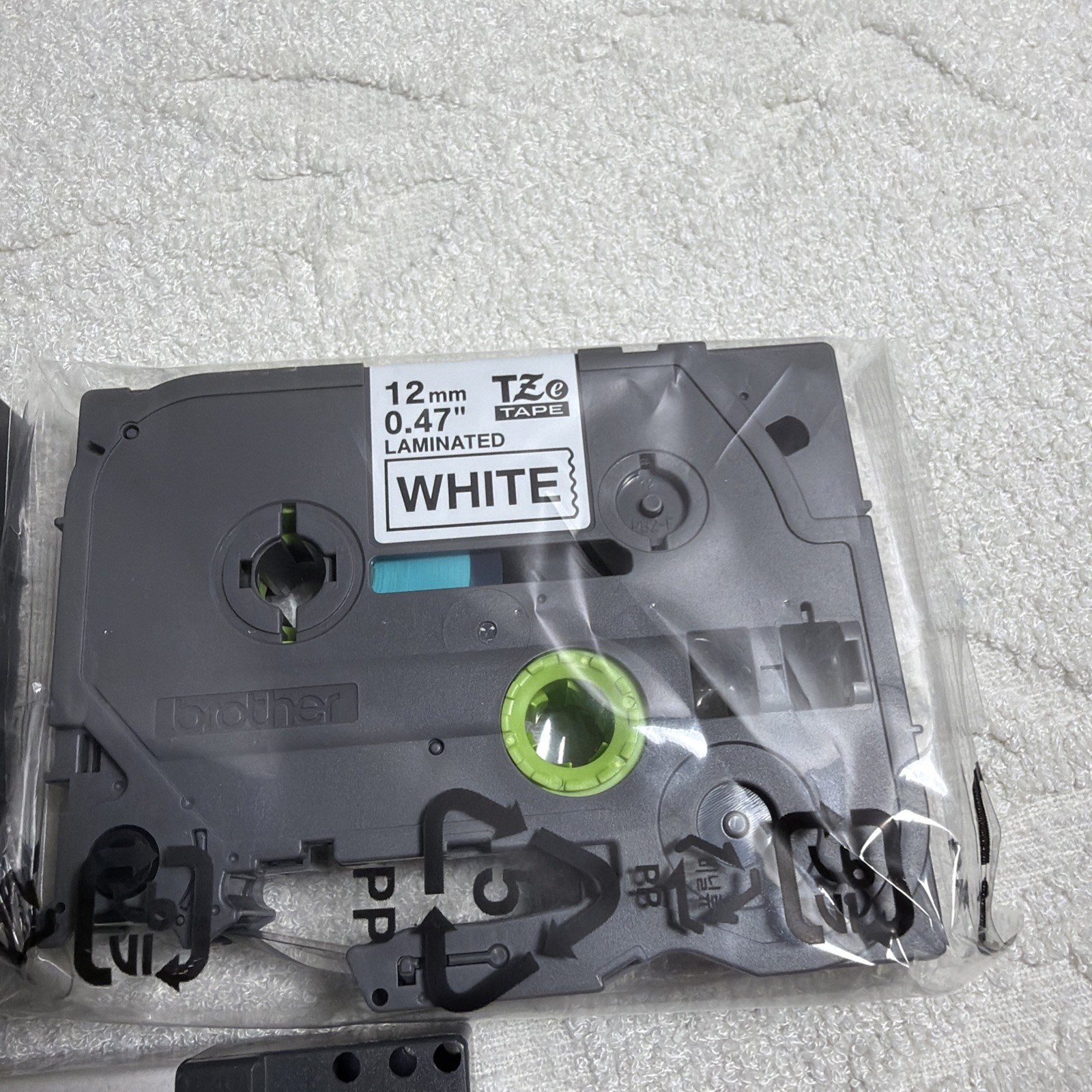 P-touch Laminated Tape 0.47 In X 26.2 ft (12mm X 8m) White, Clear, Red Ink