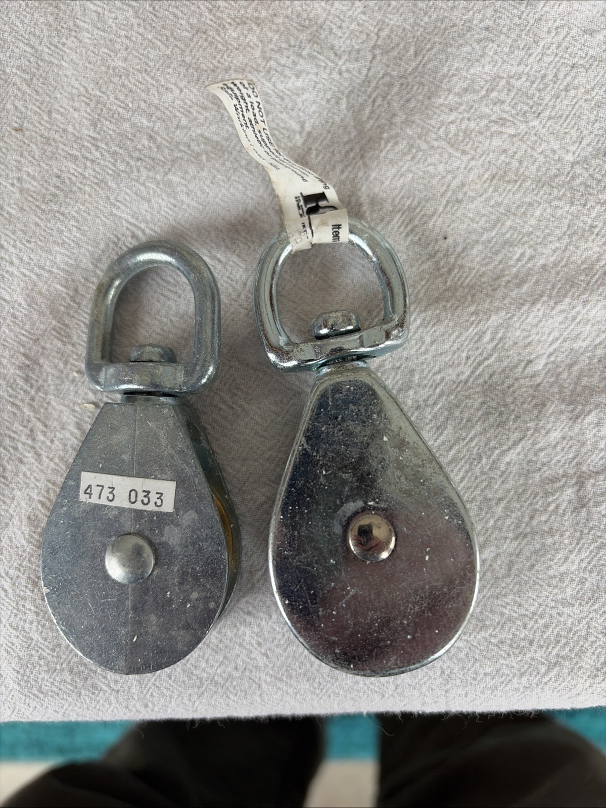 Two Swivel Pulleys for Use with Rope. See Photos for Size Specifics Provided.