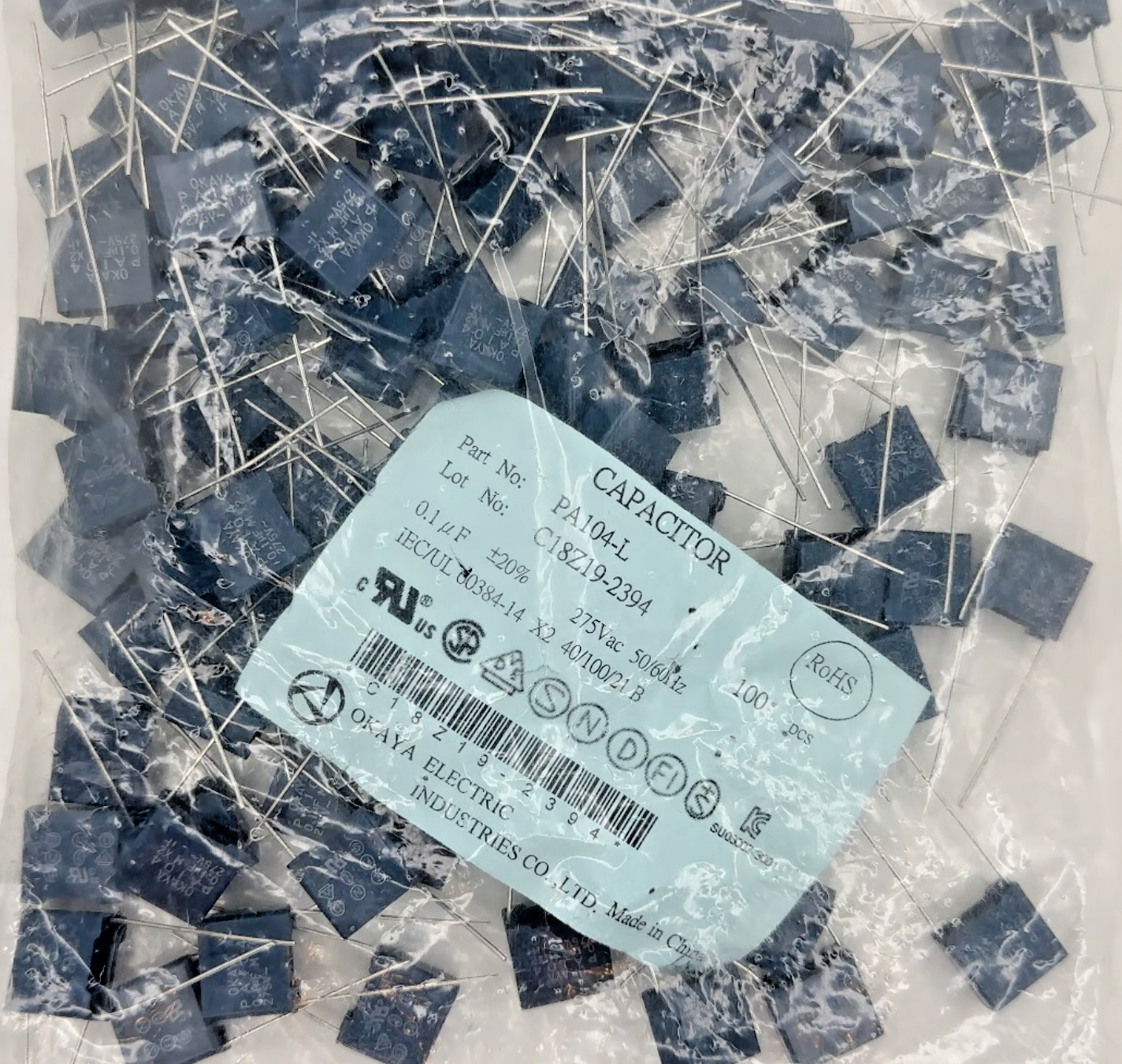 *New in Bag of 100 Pcs* Okaya PA104-L Film Capacitor 20% 0.1uF Through Hole 275V