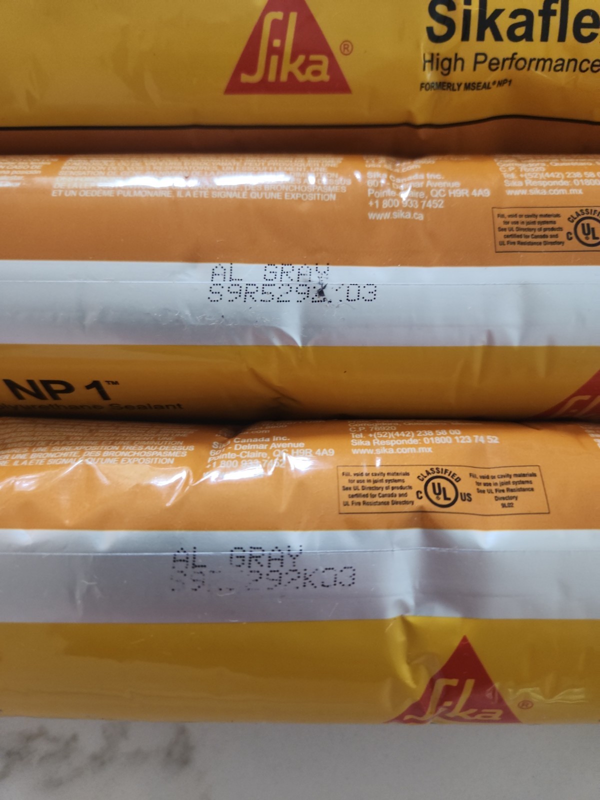 LOT OF 9 Sikaflex NP1 Polyurethane Sealant 20 Oz Sausage, Aluminum Gray