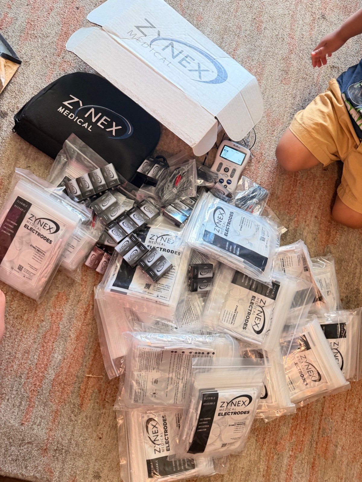zynex tens unit with tons of accessories