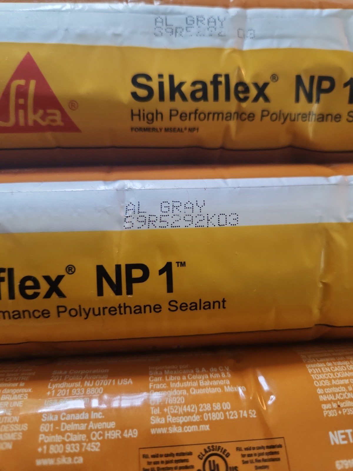 LOT OF 9 Sikaflex NP1 Polyurethane Sealant 20 Oz Sausage, Aluminum Gray