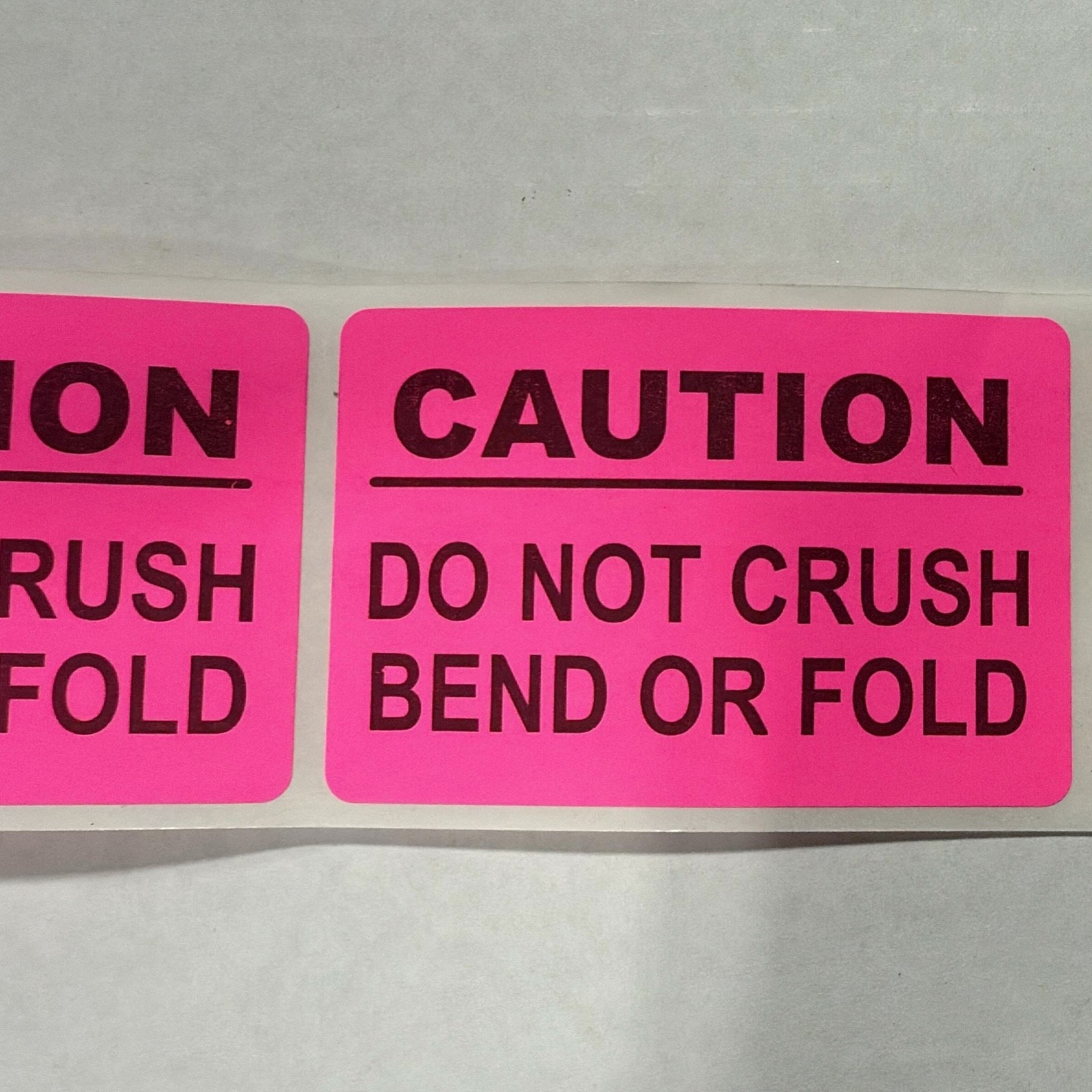 Neon Pink CAUTION Labels 2” x 3” – 250 Labels Per Roll