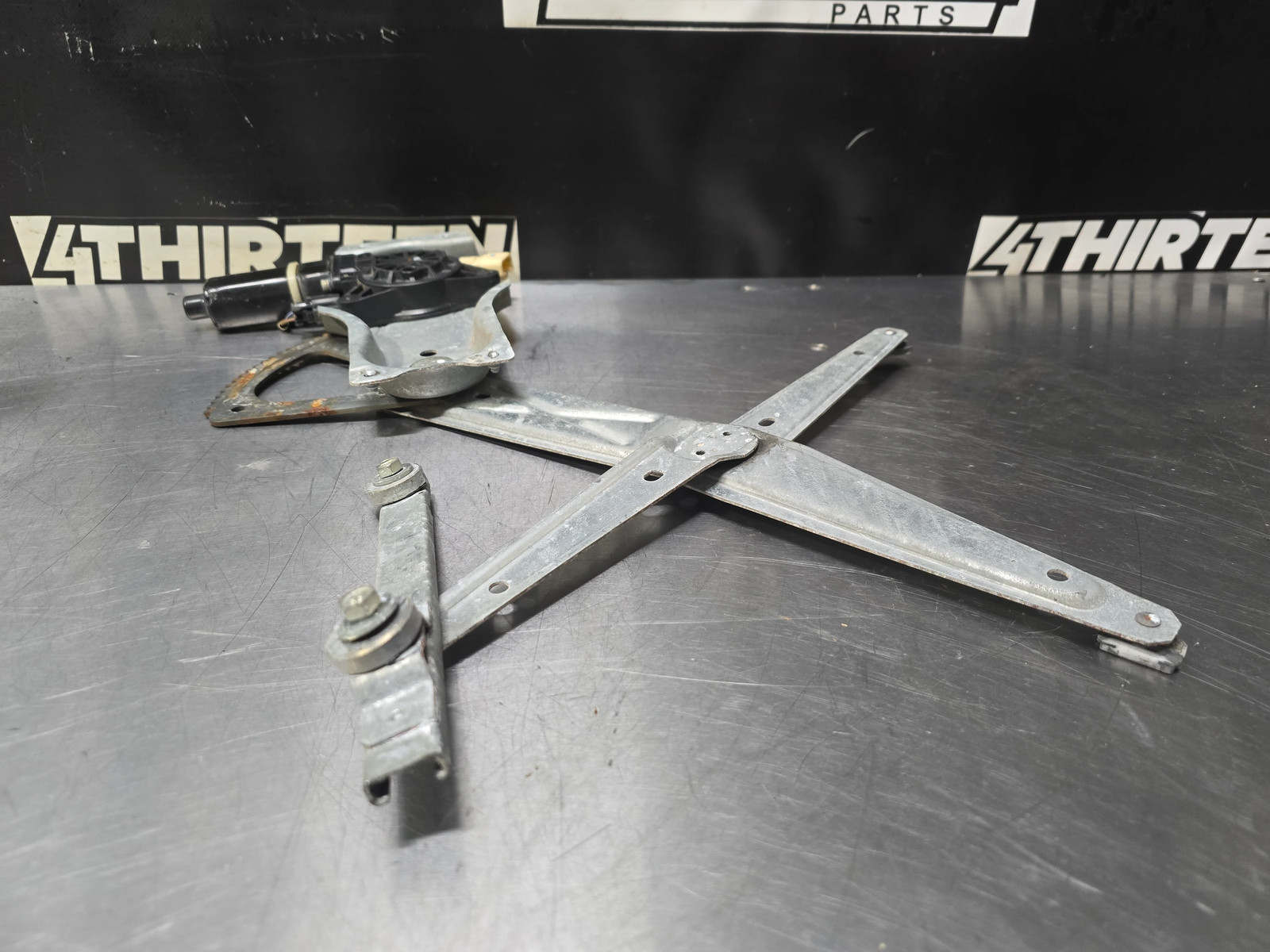 2004-06 GTO DRIVERS SIDE LH WINDOW REGULATOR ASSEMBLY W/ MOTOR – OEM #N12