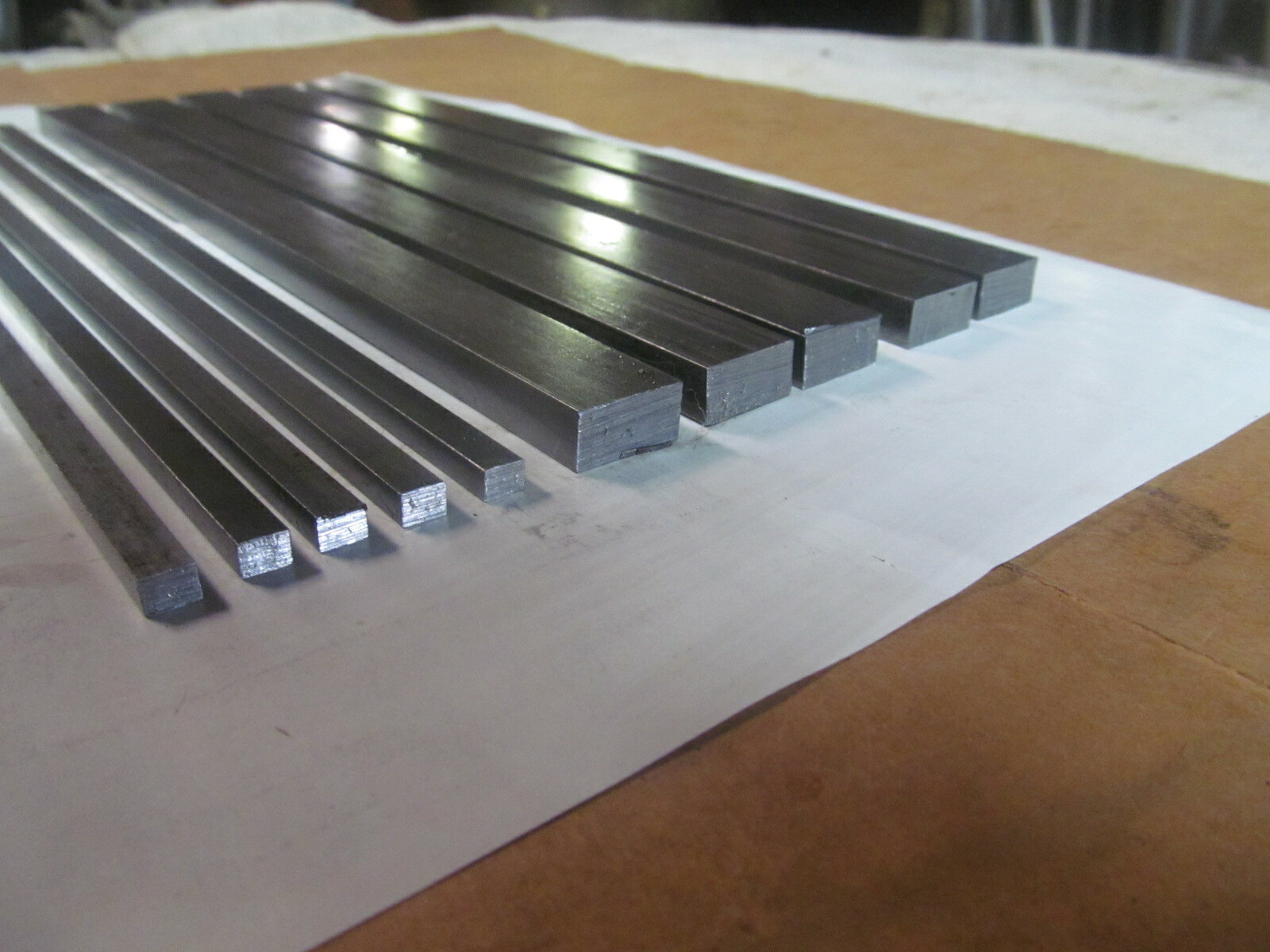 (10) PIECES OF RECTANGLE STEEL,12L14 BAR STOCK 12″ LONG (2) DIFFERENT SIZES.