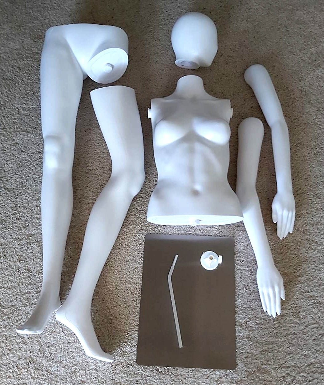 Black full body female mannequin w. Metal Base. Head and arms can be rotated