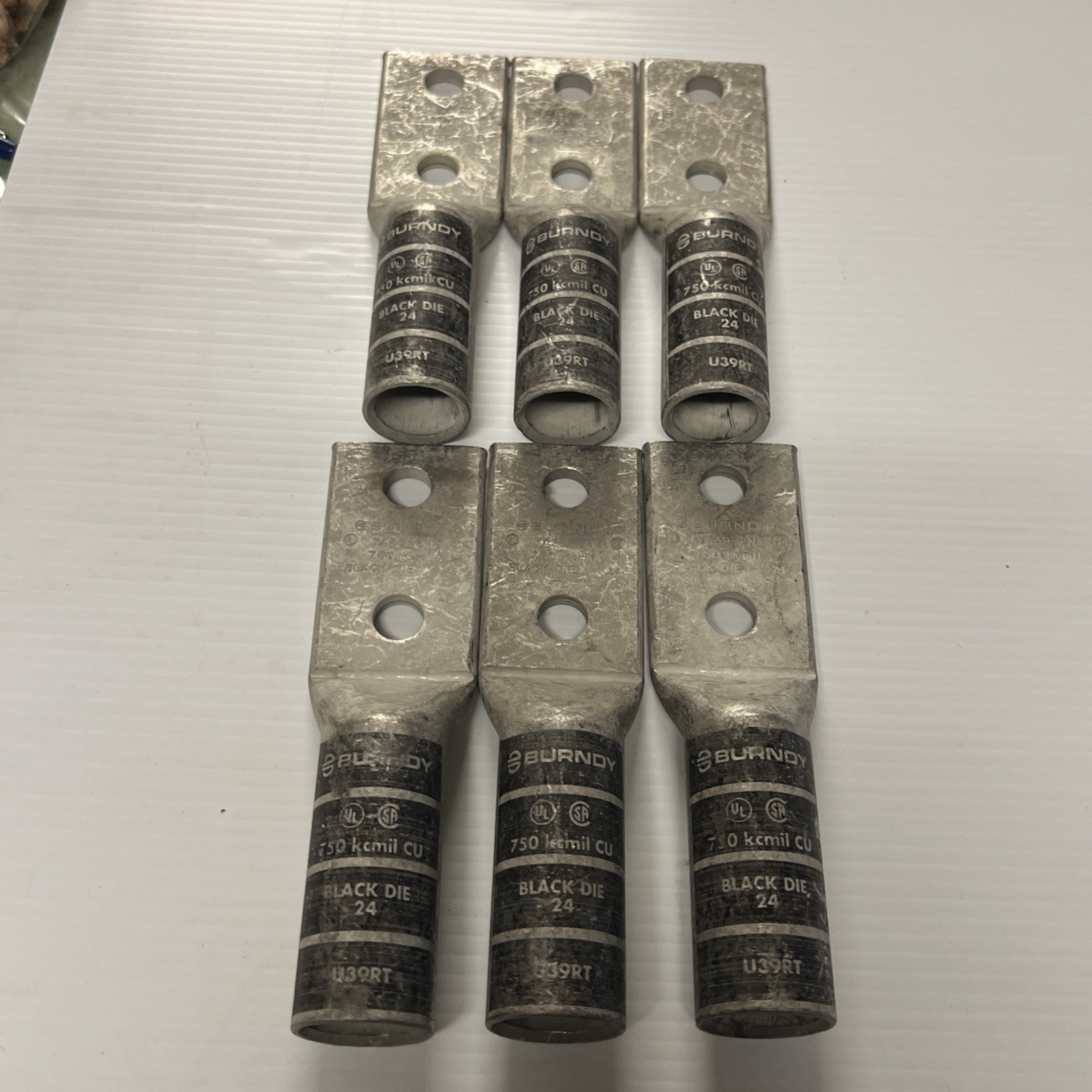 (Qty. 6) Burndy U39RT 2 Hole Lug 750 kcmil CU Black Die 24