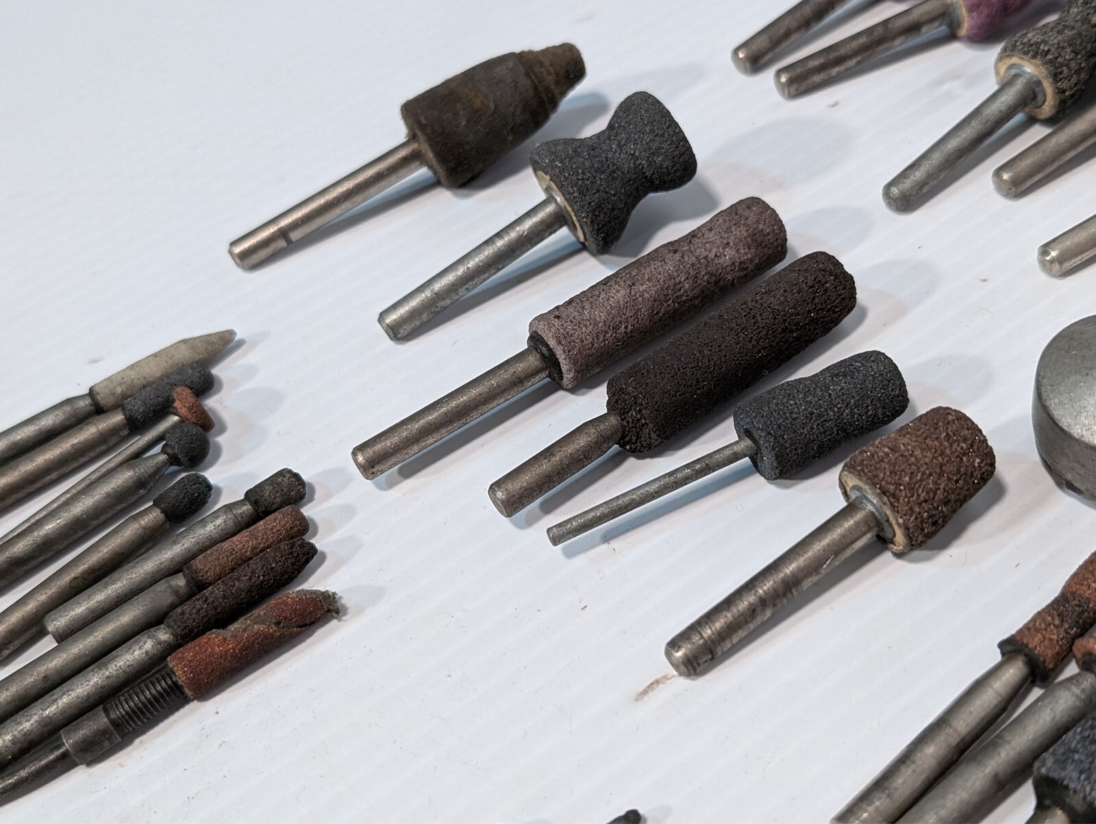 Lot of 144 mounted grinding wheels on shaft as shown, various sizes, shapes, …